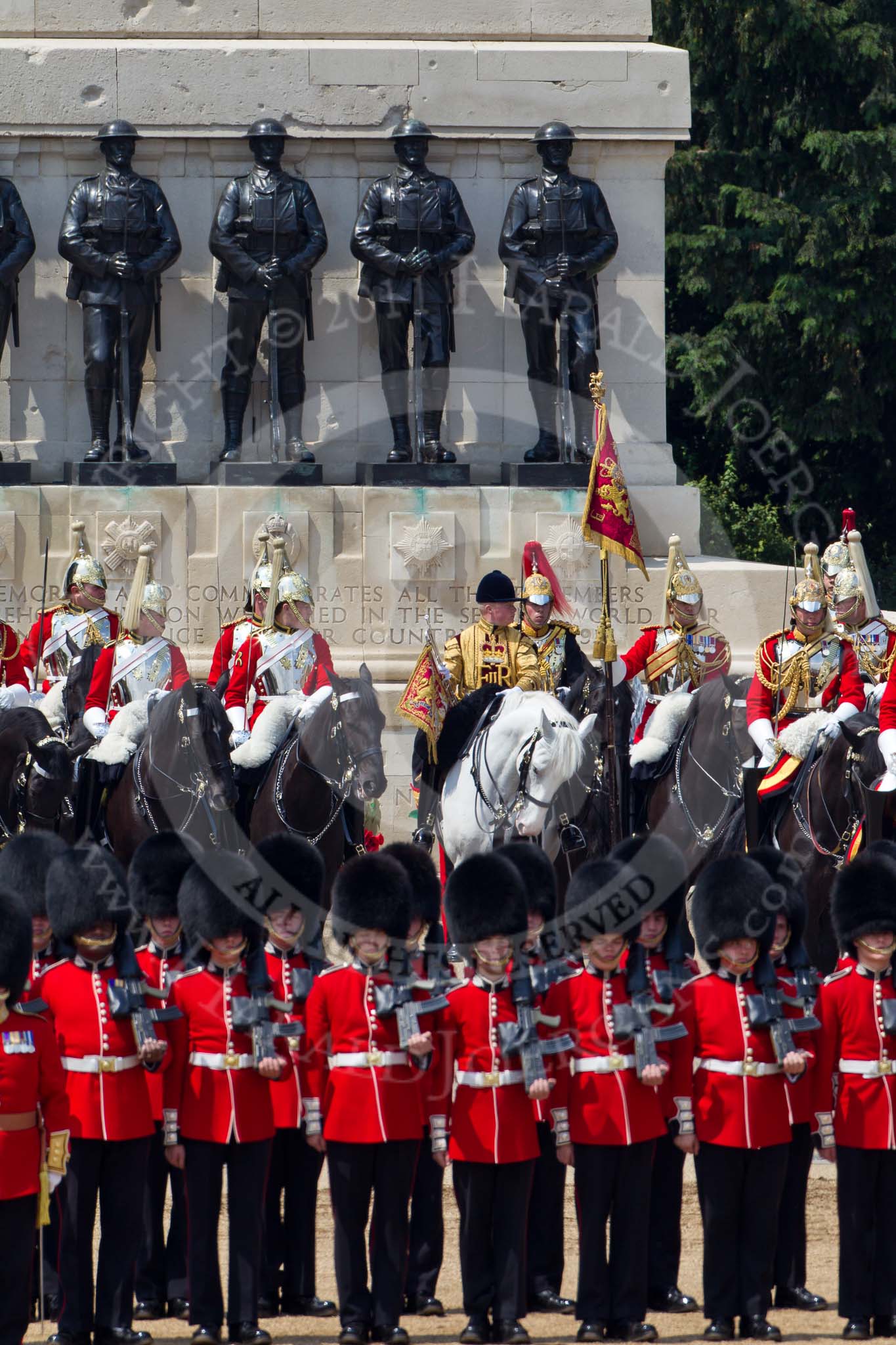 Trooping the Colour 2011: The Household Cavalry in front of the Guards Memorial. On the left, The Life Guards, with the white plumes, in the middle the Trumpeter, Standard Bearer, and Standard Coverer. In front of them No. 2 Guard, B Company Scots Guards..
Horse Guards Parade, Westminster,
London SW1,
Greater London,
United Kingdom,
on 11 June 2011 at 12:01, image #375