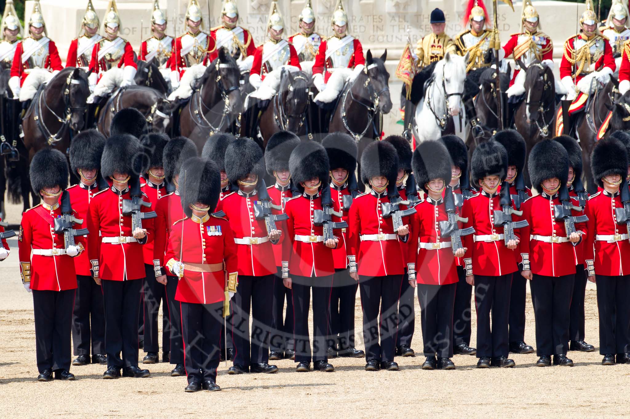 Trooping the Colour 2011: No. 2 Guard, B Company Scots Guards, waiting fo the command to march off, as the parade comes close to the end. Behind them, in front of the Guards Memorial, The Life Guards..
Horse Guards Parade, Westminster,
London SW1,
Greater London,
United Kingdom,
on 11 June 2011 at 12:01, image #377