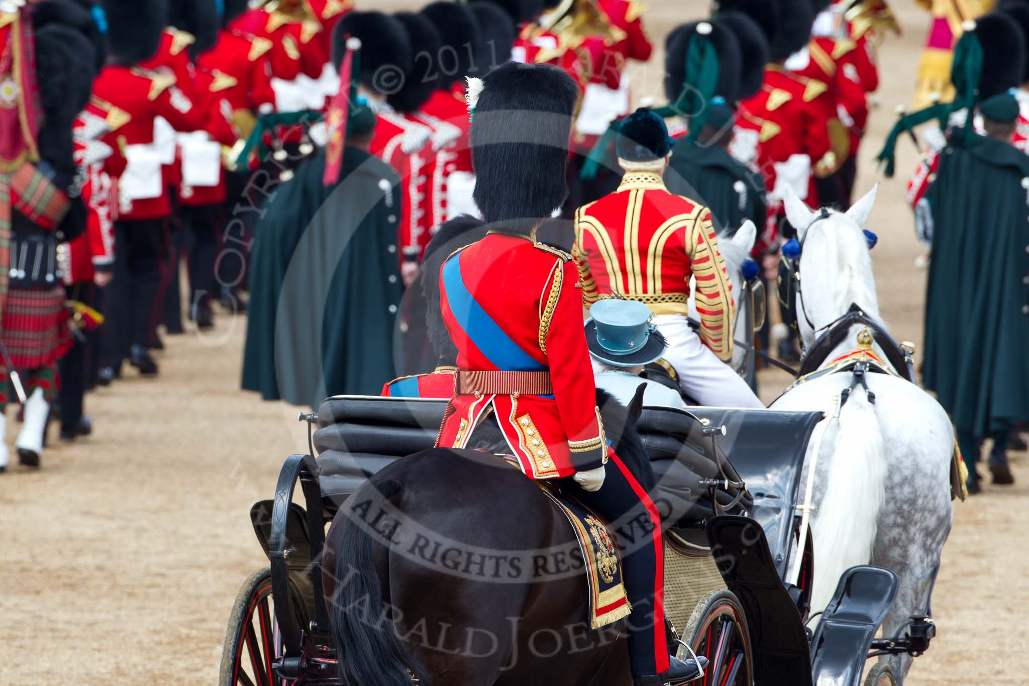 Photo 110611_121042_1D4_5458HaraldJoergens_ Trooping the Colour 2011: The end of the parade. The ivory mounted phaeton with HRH Prince Philip, The Duke of Edinburgh, and HM The Queen, followed by HRH Prince Charles, The Prince of Wales, leaving Horse Guards Parade on their way to Buckingham Palace via The Mall..
Horse Guards Parade, Westminster,
London SW1,
Greater London,
United Kingdom,
on 11 June 2011 at 12:10, image #417