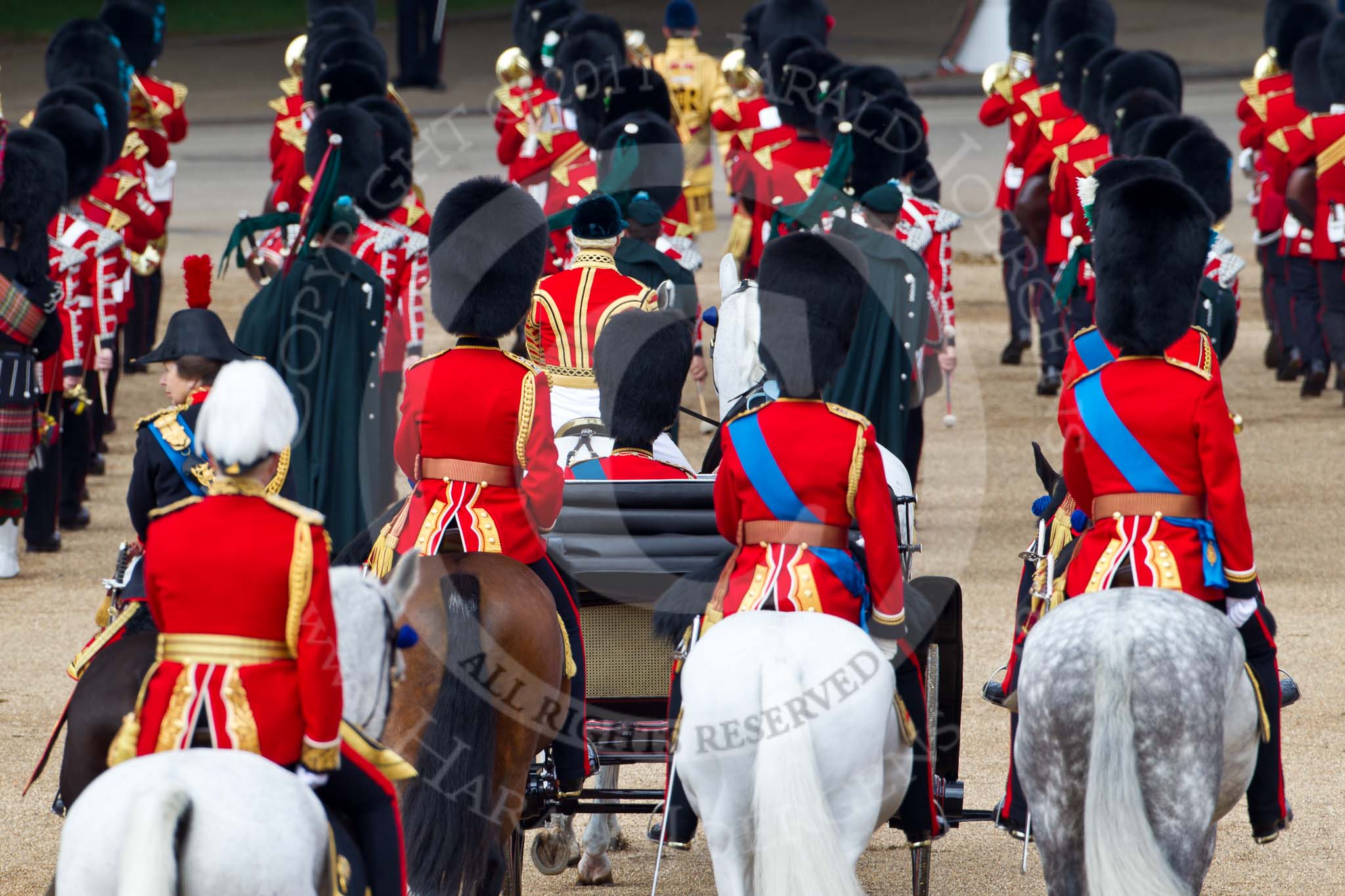 Trooping the Colour 2011: March off, the Massed Bands leaving the parade ground, followed by the Royal Procession. Behind the ivory mounted phaeton, on the left HRH Princess Anne, The Princess Royal, Colonel Blues and Royals, on her right Brigade Major Household Division Lincoln Speed, Scots Guards, on his right HRH Prince Edward, the Duke of Kent, Colonel Scots Guards, and next to him HRH Prince William, The Duke of Cambridge, Colonel Irish Guards. On the right HRH Prince Charles, The Prince of Wales, Colonel Welsh Guards.
Following them, with the white feathers, Major General Cubitt..
Horse Guards Parade, Westminster,
London SW1,
Greater London,
United Kingdom,
on 11 June 2011 at 12:11, image #420