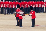 Trooping the Colour 2011: The Sergeant of the Ecort to the Colour, Colour Sergeant Chris Millin, is lowering the Colour, so that the colour case can be removed by the Duty Drummer..
Horse Guards Parade, Westminster,
London SW1,
Greater London,
United Kingdom,
on 11 June 2011 at 10:33, image #54