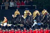 Trooping the Colour 2011: HM The Queen during the inspection of the troops. In charge of the ivory mounted phaeton Jack Hargreaves, Head Coachman. In the front, No. 4 Guard, Nijmegen Company Grenadier Guards, and in the background the Mounted Bands of the Household Cavalry..
Horse Guards Parade, Westminster,
London SW1,
Greater London,
United Kingdom,
on 11 June 2011 at 11:05, image #164