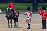 Trooping the Colour 2011: The Lone Drummer, Lance Corporal Gordon Prescott, just leaving the line, marching to a position at the right of the Escort to the Colour, where he will bear the 'drummers call', which will start the next phase of the parade.
On horseback the Major of the Parade, Major Benedict Peter Norman Ramsay, Welsh Guards..
Horse Guards Parade, Westminster,
London SW1,
Greater London,
United Kingdom,
on 11 June 2011 at 11:16, image #194