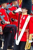 Trooping the Colour 2011: Close-up of the Ensign, Lieutenant Tom Ogilvy, carrying the Colour in his white colour belt..
Horse Guards Parade, Westminster,
London SW1,
Greater London,
United Kingdom,
on 11 June 2011 at 11:35, image #233