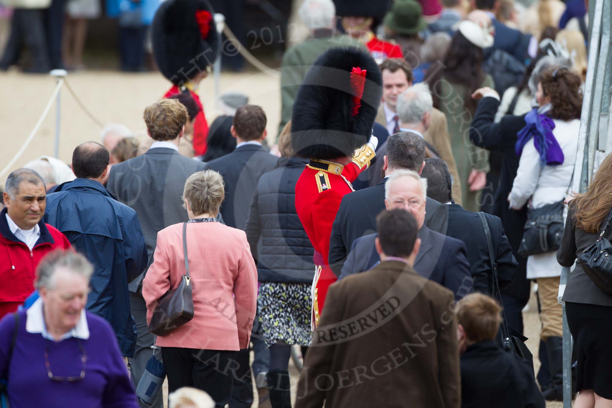 The Colonel's Review 2012: Leading the way - a Major from the Coldstream Guards helping spectators to find the right grandstand..
Horse Guards Parade, Westminster,
London SW1,

United Kingdom,
on 09 June 2012 at 09:38, image #6
