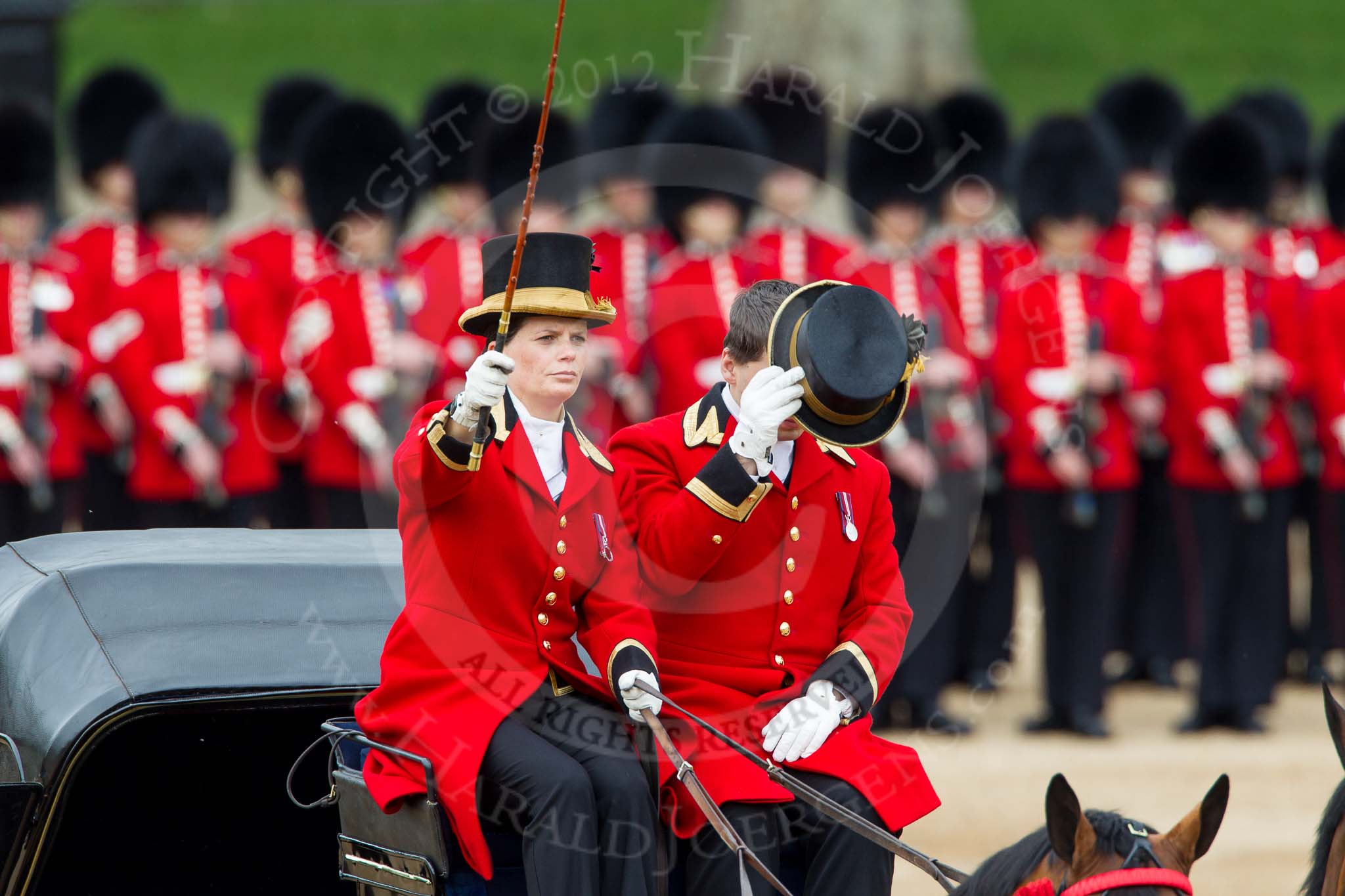 The Colonel's Review 2012: The second of the two carriages that would bring members of the Royal family to the event. Lady Coachman Phillipa Jackson is saluting with her whip..
Horse Guards Parade, Westminster,
London SW1,

United Kingdom,
on 09 June 2012 at 10:49, image #123