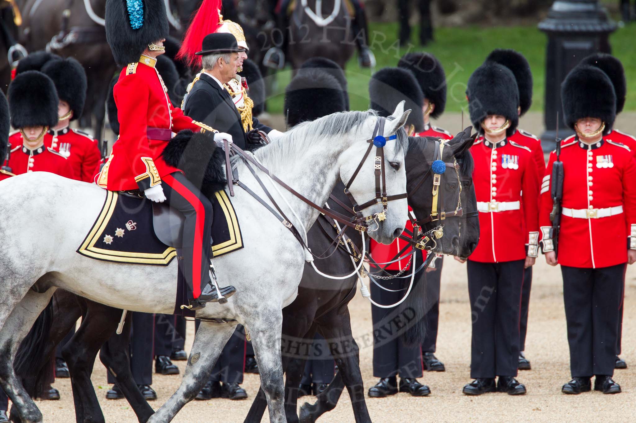 The Colonel's Review 2012: Representing the Royal Colonels (guessing here!): On the left, a Captain of the Irish Guards, riding the horse of the Duke of Cambridge, in the middle the Queen's Stud Groom, riding the Prince of Wales's horse, and on the right a Lieutenant Colonel of the Blues and Royal, riding the horse of the Princess Royal..
Horse Guards Parade, Westminster,
London SW1,

United Kingdom,
on 09 June 2012 at 11:01, image #173