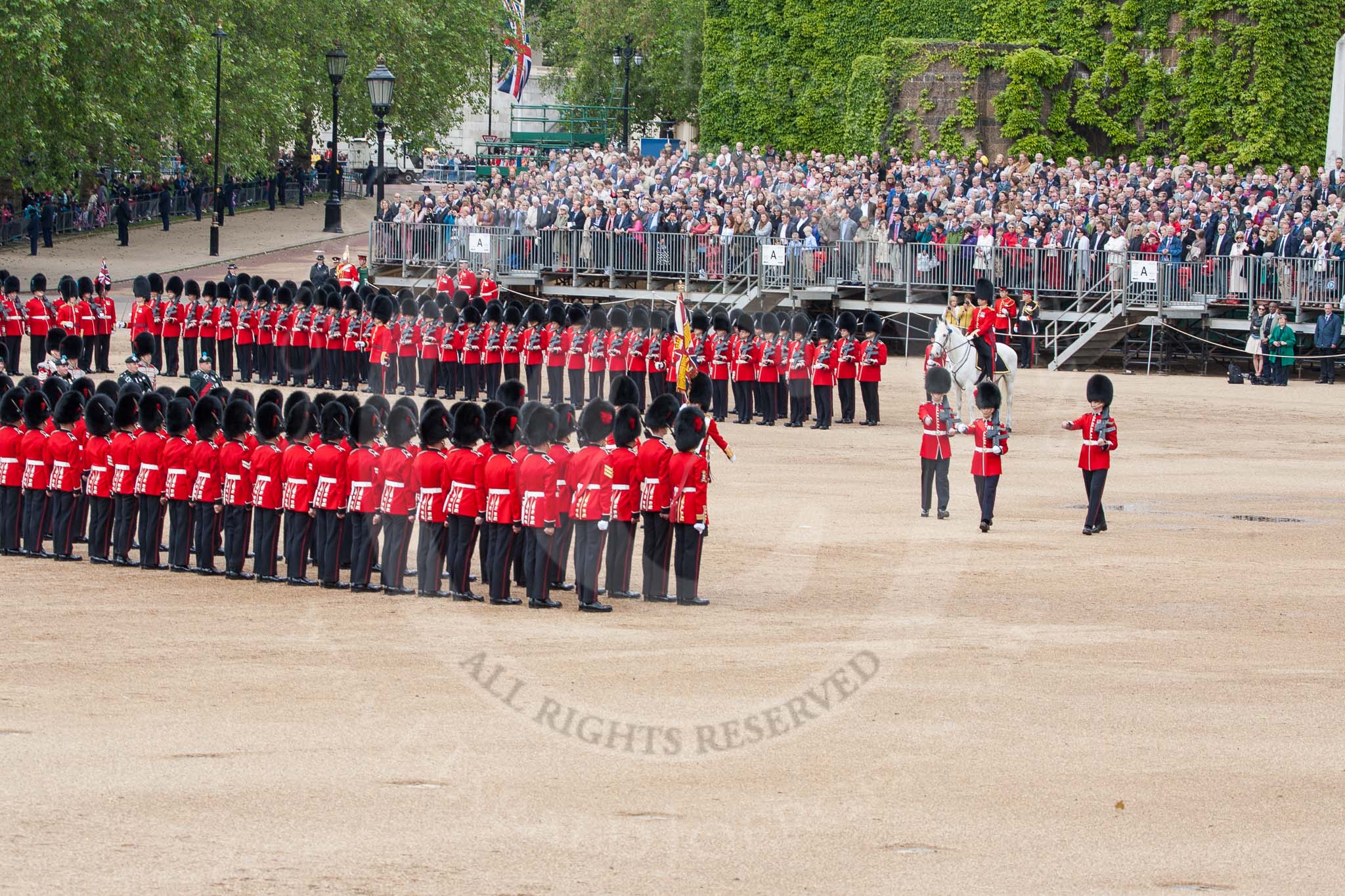 The Colonel's Review 2012: The Colour is now in the hands of No. 1 Guard, and the Colour Sergeant and the two Sentries (on the very right) have done their duty, and are now marching off..
Horse Guards Parade, Westminster,
London SW1,

United Kingdom,
on 09 June 2012 at 11:19, image #277