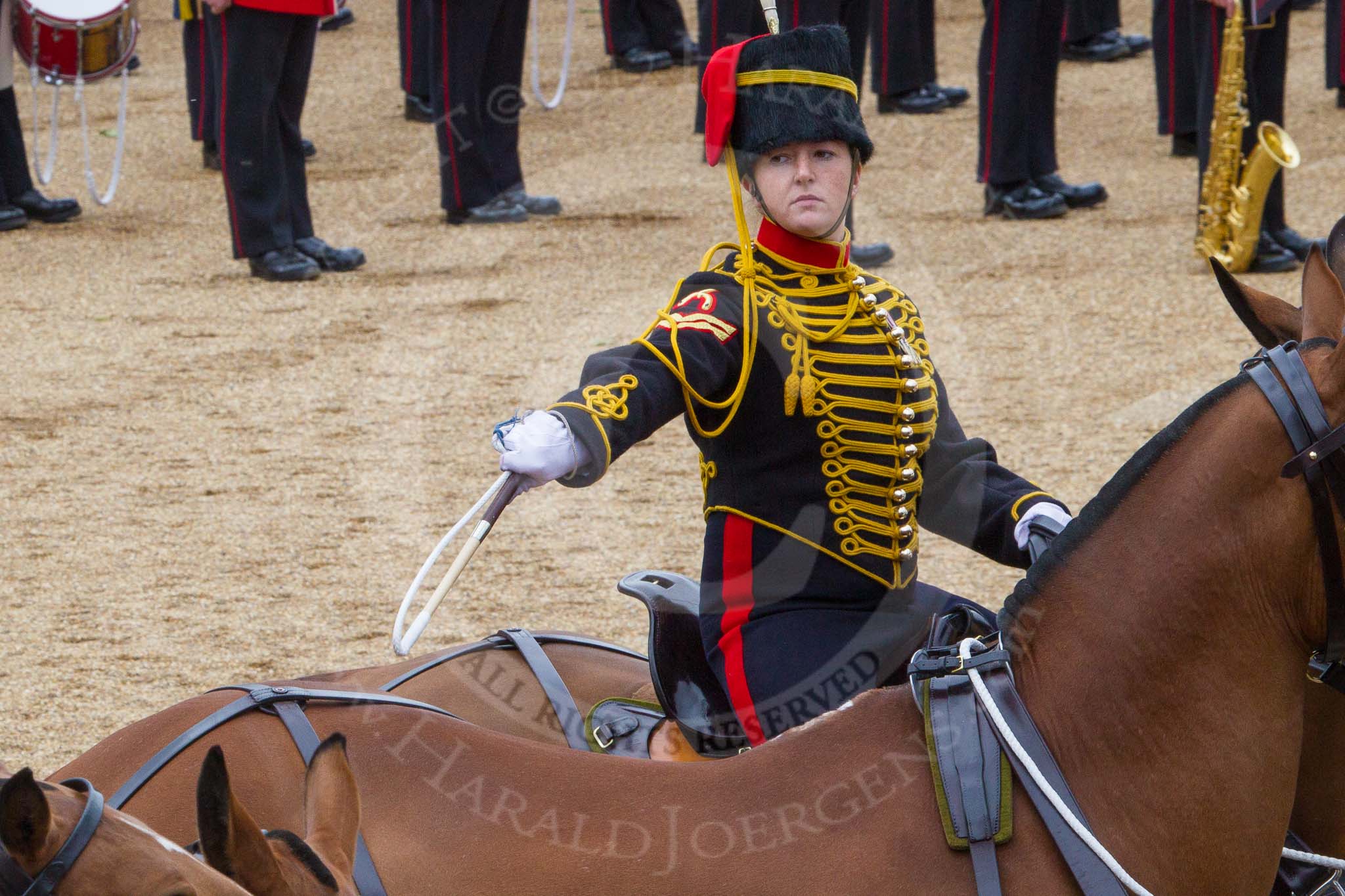 The Colonel's Review 2012: A ceremonial gunner on one of the six horses that pull a 13-pounder gum, saluting with the whip..
Horse Guards Parade, Westminster,
London SW1,

United Kingdom,
on 09 June 2012 at 11:52, image #400