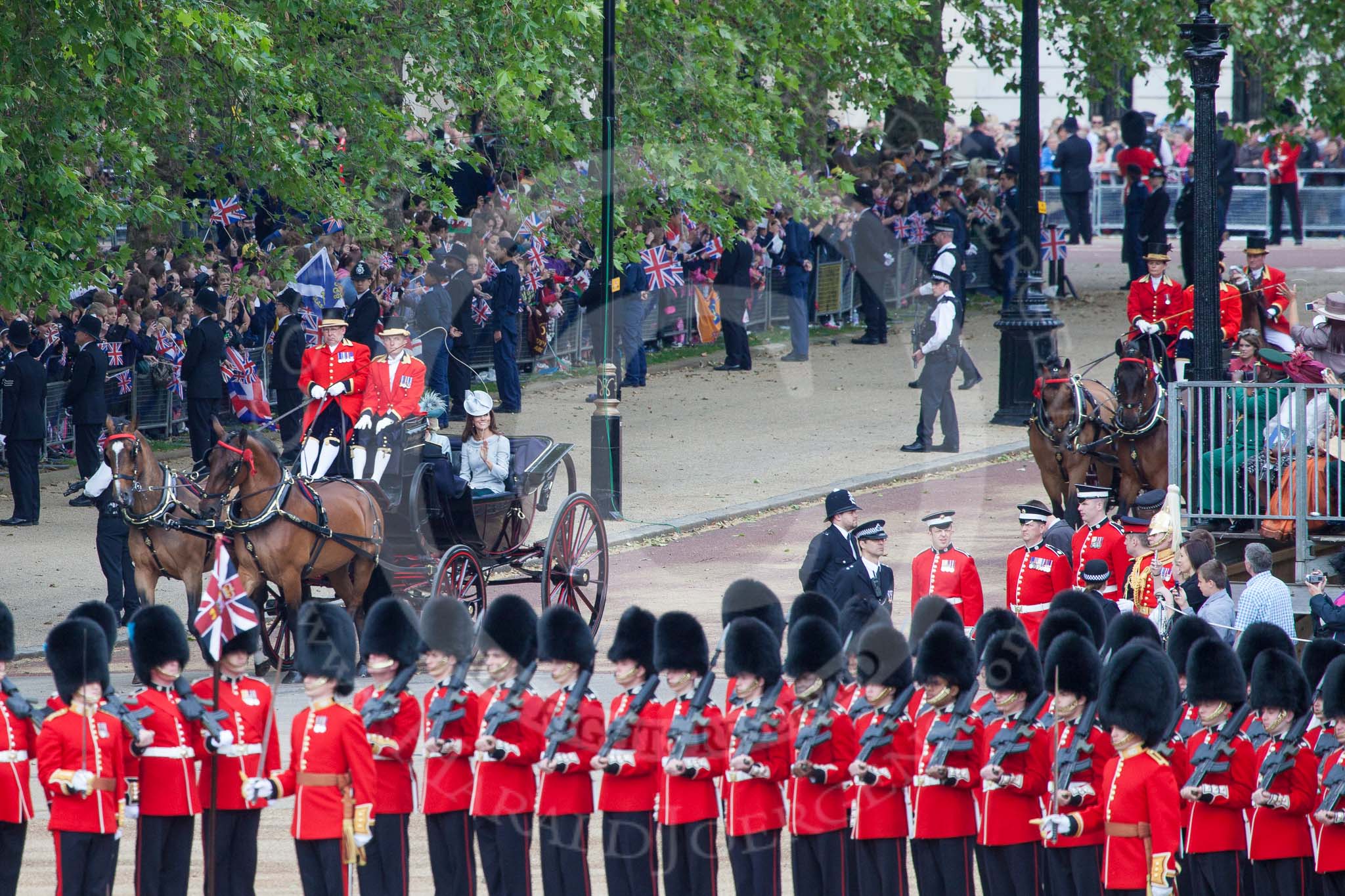Trooping the Colour 2012: The first carriage coming down the approach road from the Mall, carrying The Duchess of Cambridge, the Duchess of Cornwall, and Prince Harry..
Horse Guards Parade, Westminster,
London SW1,

United Kingdom,
on 16 June 2012 at 10:49, image #112