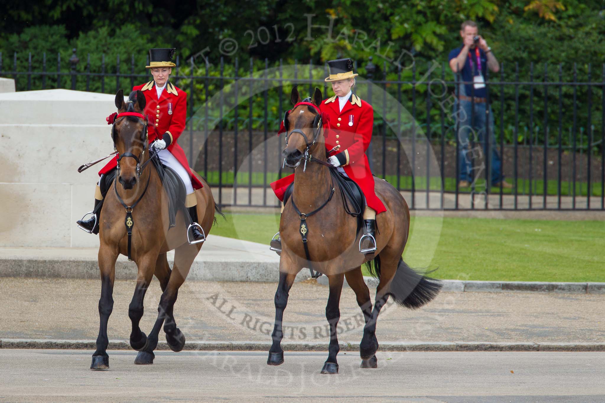 Trooping the Colour 2012: Two outriders (female liveried grooms from the Royal Mews) leading the first group of carriages..
Horse Guards Parade, Westminster,
London SW1,

United Kingdom,
on 16 June 2012 at 10:50, image #116