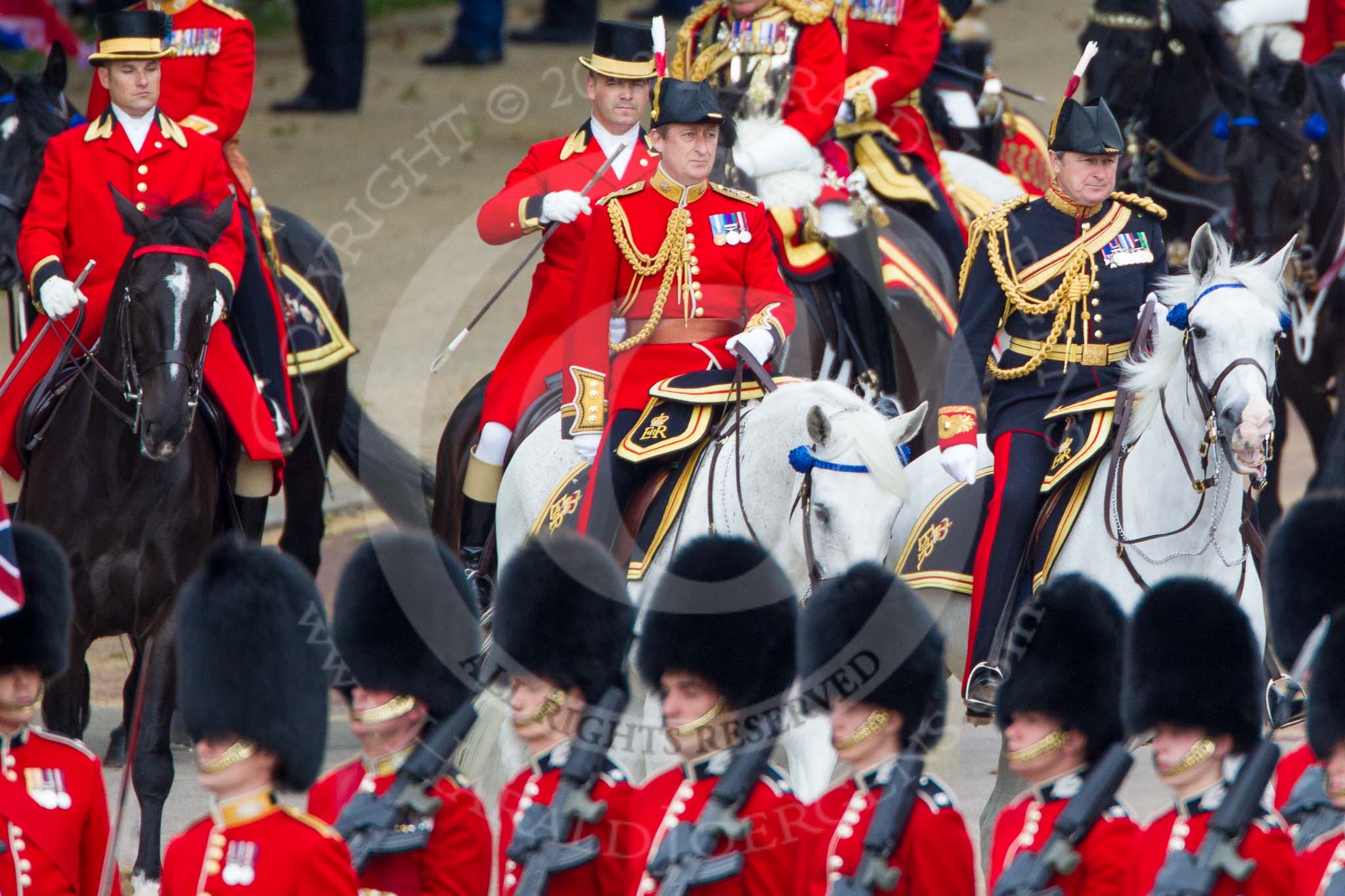Trooping the Colour 2012: In the red uniform, the Equerry in Waiting to Her Majesty, Lieutenant Colonel A F Matheson of Matheson, younger, and the Crown Equerry, Colonel W T Browne. Behind them two Grooms from the Royal Household..
Horse Guards Parade, Westminster,
London SW1,

United Kingdom,
on 16 June 2012 at 10:58, image #157