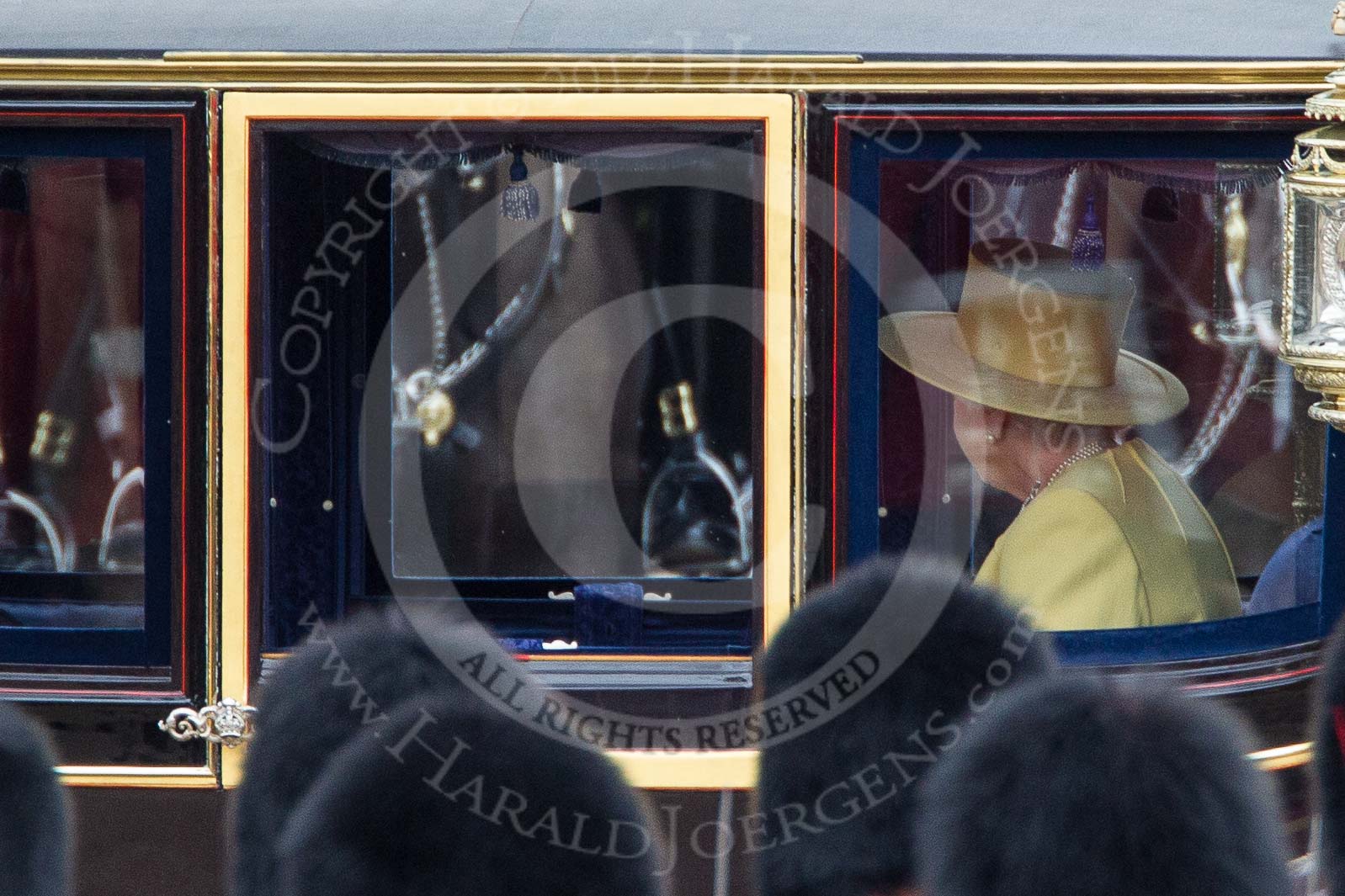 Trooping the Colour 2012: A closer look HM The Queen in the Glass Coach inspecting the Blues and Royals. In front the bearskins of guardsmen from No. 1 Guard..
Horse Guards Parade, Westminster,
London SW1,

United Kingdom,
on 16 June 2012 at 11:06, image #230