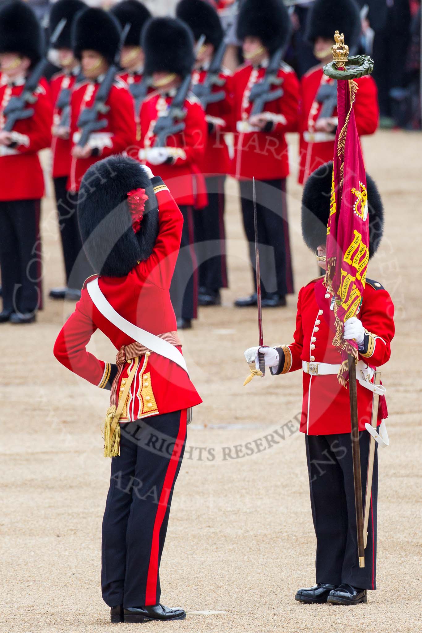 Trooping the Colour 2012: The Regimental Sergeant Major of No. 1 Guard, pushes his sord to safety, before receiving the Colour from the Colour Sergeant..
Horse Guards Parade, Westminster,
London SW1,

United Kingdom,
on 16 June 2012 at 11:21, image #306