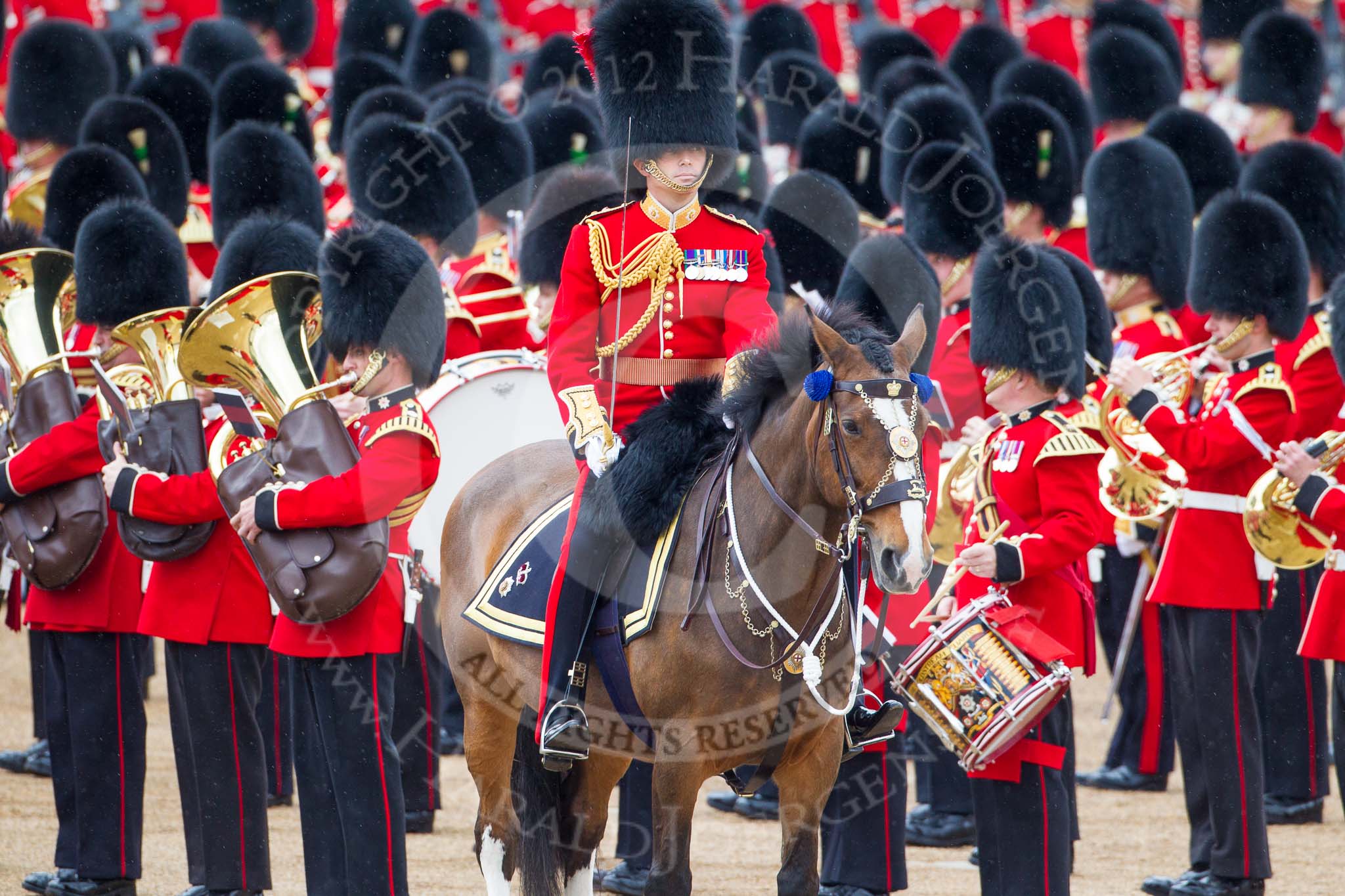 Trooping the Colour 2012: The Field Officer in Brigade Waiting, Lieutenant Colonel R C N Sergeant, Coldstream Guards, about to order "Present Arms" whilst the Massed Bands are playing the National Anthem..
Horse Guards Parade, Westminster,
London SW1,

United Kingdom,
on 16 June 2012 at 11:25, image #336