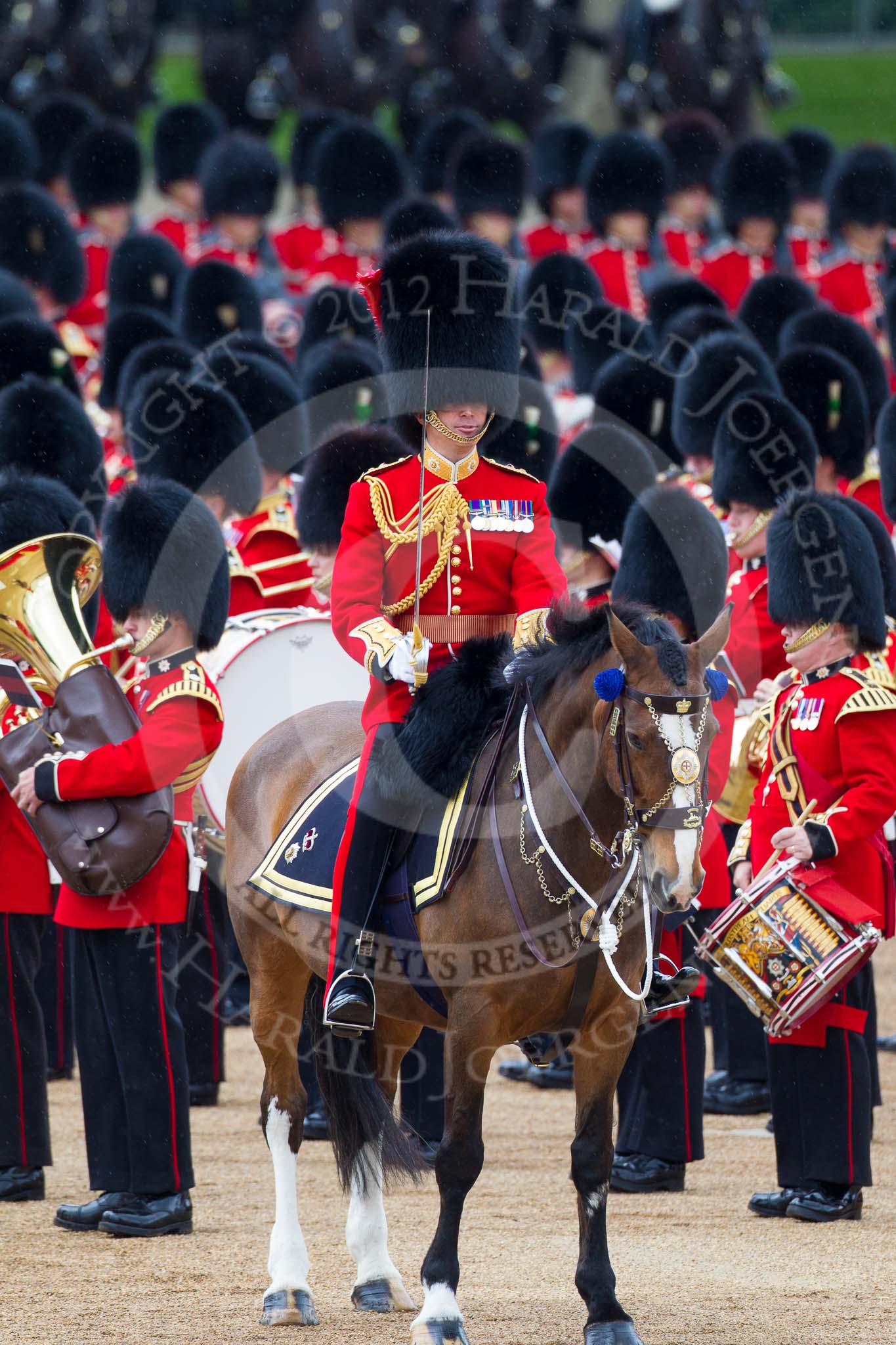 Trooping the Colour 2012: The Field Officer in Brigade Waiting, Lieutenant Colonel R C N Sergeant, Coldstream Guards, about to order "Present Arms" whilst the Massed Bands are playing the National Anthem..
Horse Guards Parade, Westminster,
London SW1,

United Kingdom,
on 16 June 2012 at 11:25, image #337
