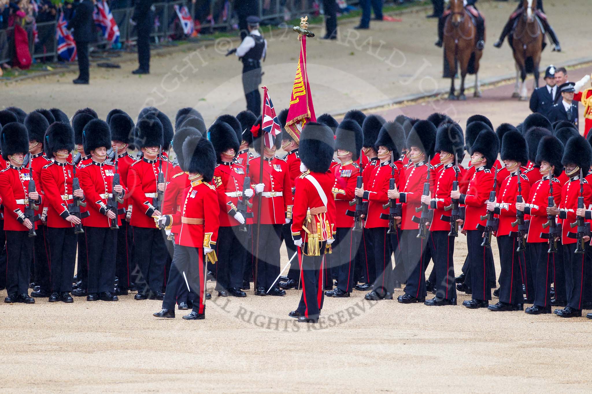 Trooping the Colour 2012: The Colour has been trooped along No. 6 Guard, F Company Scots Guards, on the right hand side of Horse Guards Parade, and the Ensign now turns to the left, to troop the Colour along No. 5 to No. 2 Guard..
Horse Guards Parade, Westminster,
London SW1,

United Kingdom,
on 16 June 2012 at 11:26, image #343