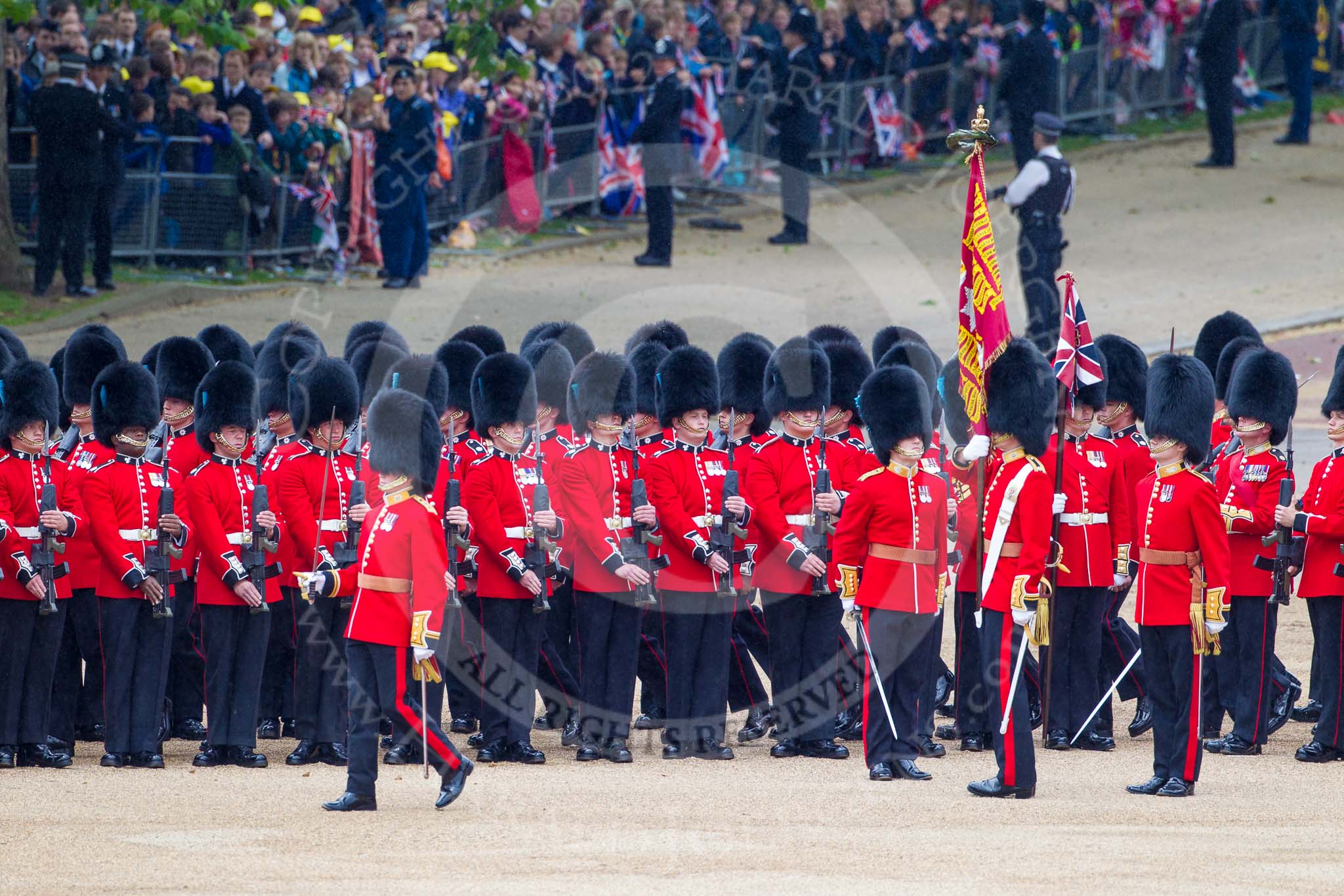 Trooping the Colour 2012: The Colour has been trooped along No. 6 Guard, F Company Scots Guards, on the right hand side of Horse Guards Parade, and the Ensign now turns to the left, to troop the Colour along No. 5 to No. 2 Guard..
Horse Guards Parade, Westminster,
London SW1,

United Kingdom,
on 16 June 2012 at 11:26, image #344