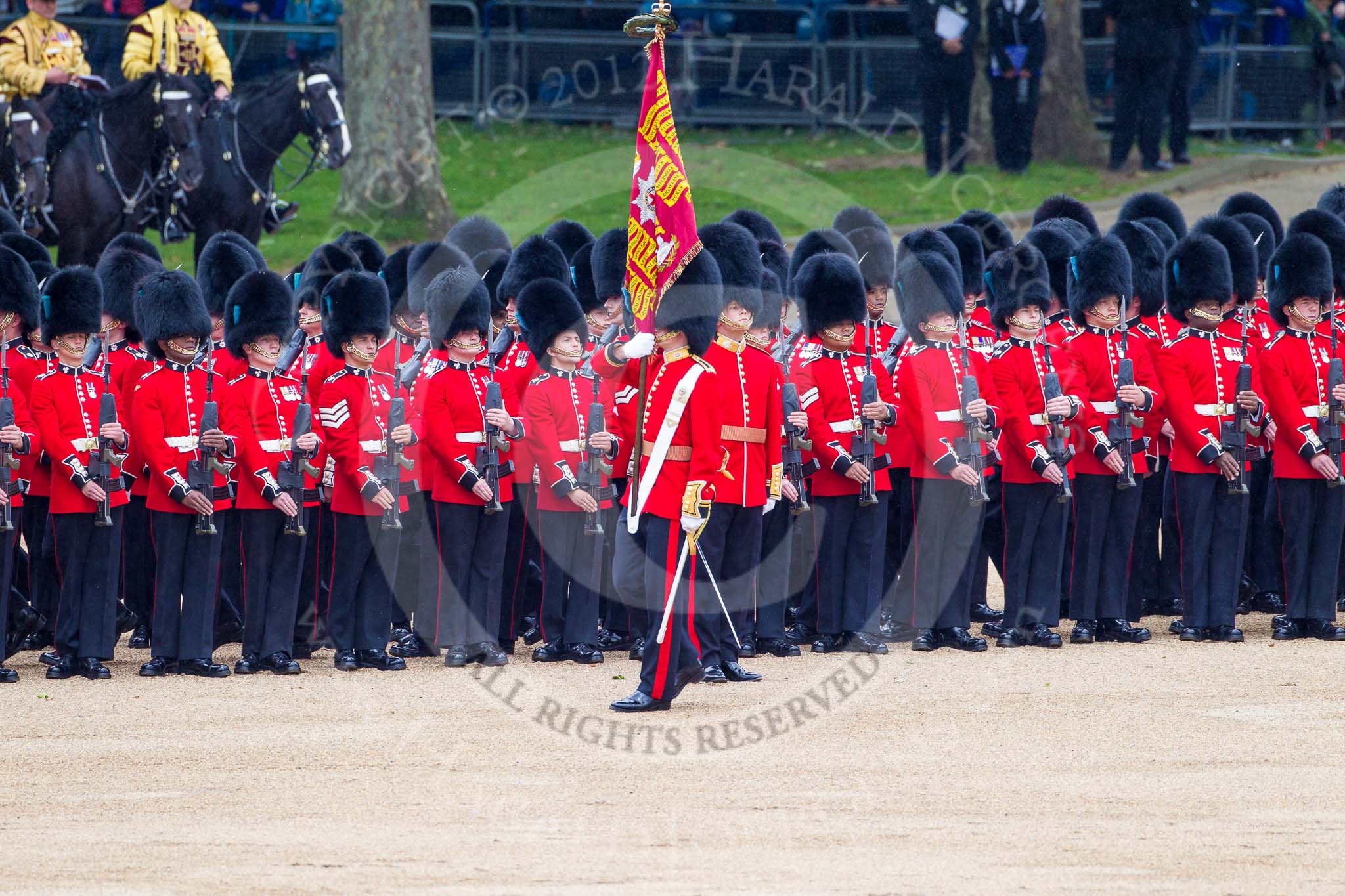 Trooping the Colour 2012: The Ensign, Second Lieutenant Hugo C Codrington, is trooping the Colour along No. 5 Guard, 1st Battalion Irish Guards, whilst the Escort to the Colour, No. 1 Guard, is marching between the two lines of guardsmen..
Horse Guards Parade, Westminster,
London SW1,

United Kingdom,
on 16 June 2012 at 11:26, image #346