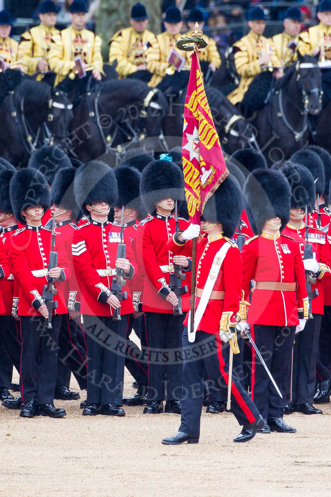 Trooping the Colour 2012: The Ensign, Second Lieutenant Hugo C Codrington, is trooping the Colour along No. 4 Guard, Nijmegen Company Grenadier Guards, whilst the Escort to the Colour, No. 1 Guard, is marching between the two lines of guardsmen..
Horse Guards Parade, Westminster,
London SW1,

United Kingdom,
on 16 June 2012 at 11:26, image #350