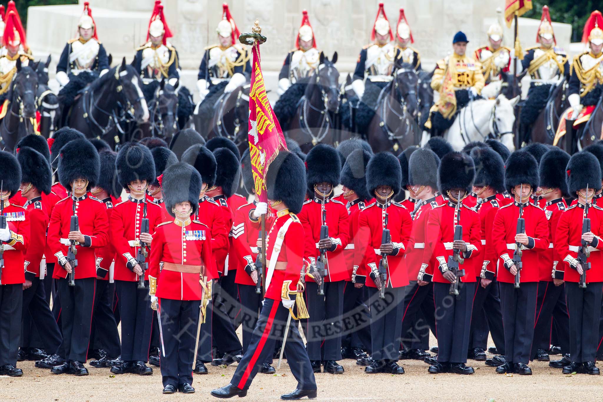 Trooping the Colour 2012: The Ensign, Second Lieutenant Hugo C Codrington, is trooping the Colour along No. 3 Guard, No. 7 Company, Coldstream Guards, whilst the Escort to the Colour, No. 1 Guard, is marching between the two lines of guardsmen..
Horse Guards Parade, Westminster,
London SW1,

United Kingdom,
on 16 June 2012 at 11:27, image #355