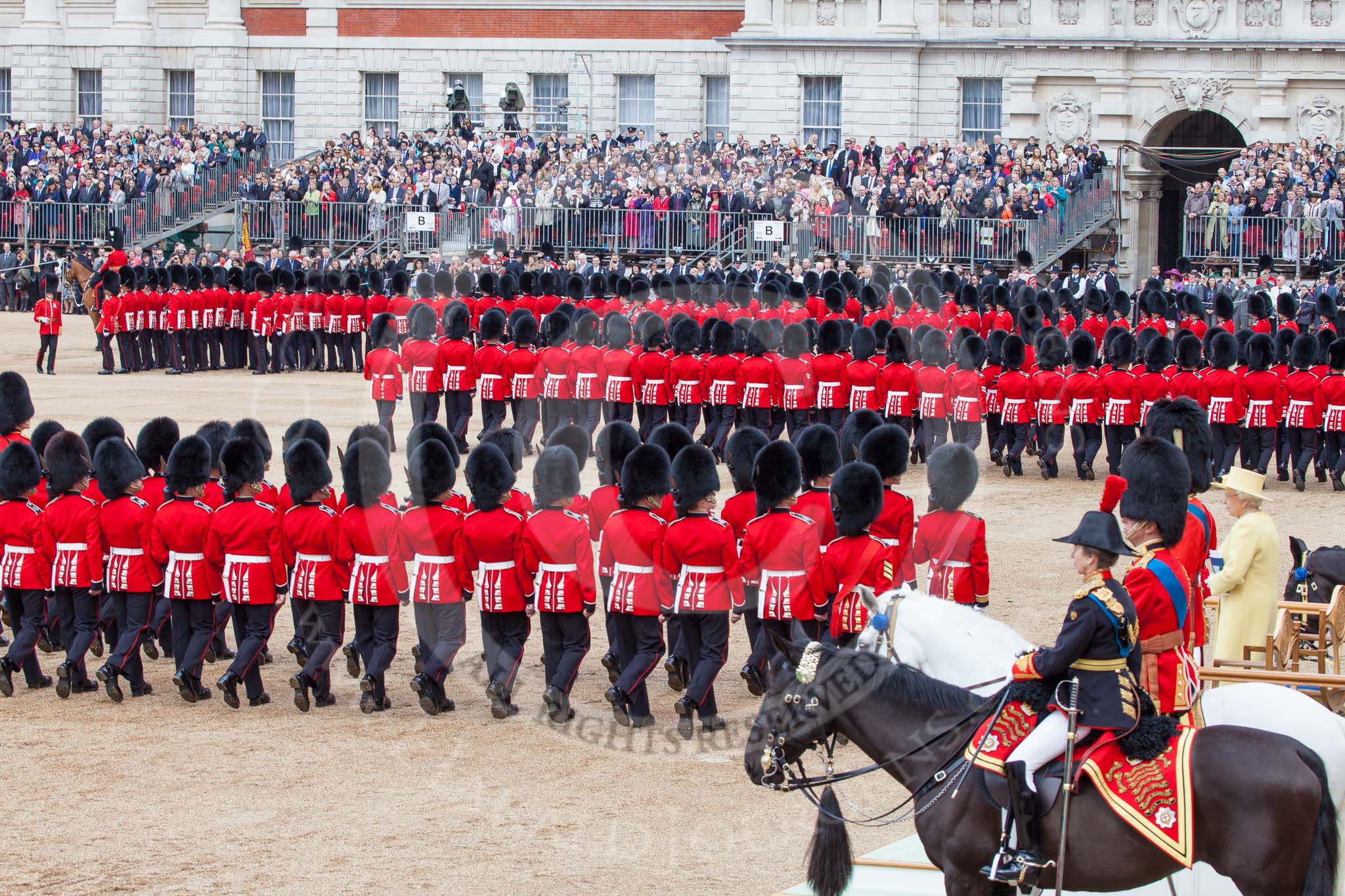 Trooping the Colour 2012: After all guards divisions have marched past Her Majesty in slow time, they are abot to march around Horse Guards parade again in quick time. On the top left No. 1 Guard, the Escort to the Colour, with the Colour just visible..
Horse Guards Parade, Westminster,
London SW1,

United Kingdom,
on 16 June 2012 at 11:38, image #439