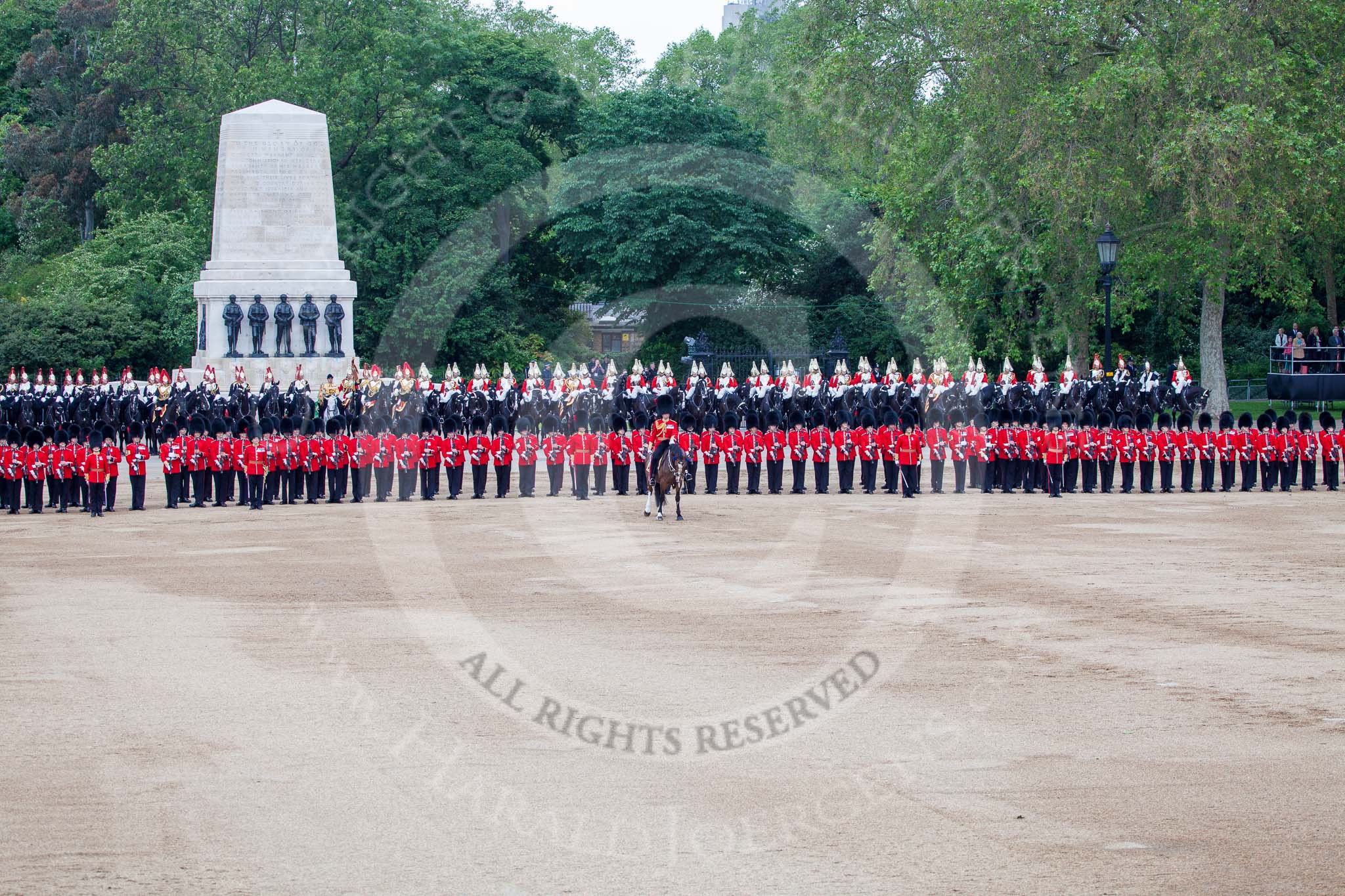 Trooping the Colour 2012: Horse Guards Parade between the Ride Past and the March Off. In the centre the Field Officer, behind the long row of guardsmen formed by No. 1 to No. 5 Guard the Household Cavalry, to the left of the Guards Memorial The Blues and Royals, to the right The Life Guards..
Horse Guards Parade, Westminster,
London SW1,

United Kingdom,
on 16 June 2012 at 12:02, image #611