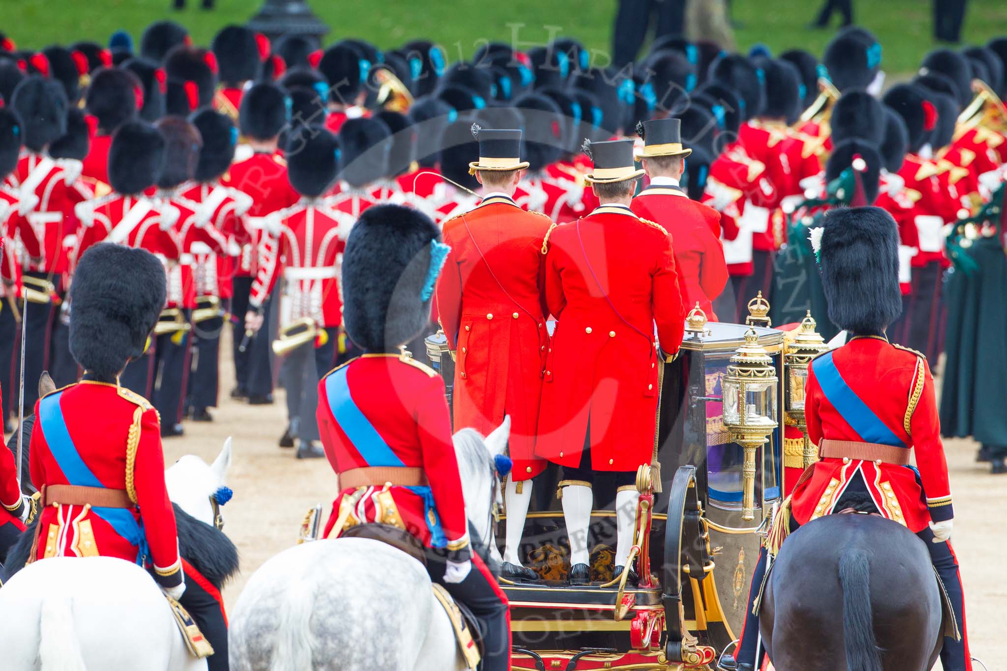 Trooping the Colour 2012: The March Off - the Massed Bands are leaving Horse Guards Parade towards The Mall, followed by HM The Queen in the Glass Coach. Behind them the Royal Colonels - HRH The Duke of Kent, HRH The The of Cambridge, and on the right HRH The Prince of Wales..
Horse Guards Parade, Westminster,
London SW1,

United Kingdom,
on 16 June 2012 at 12:12, image #676