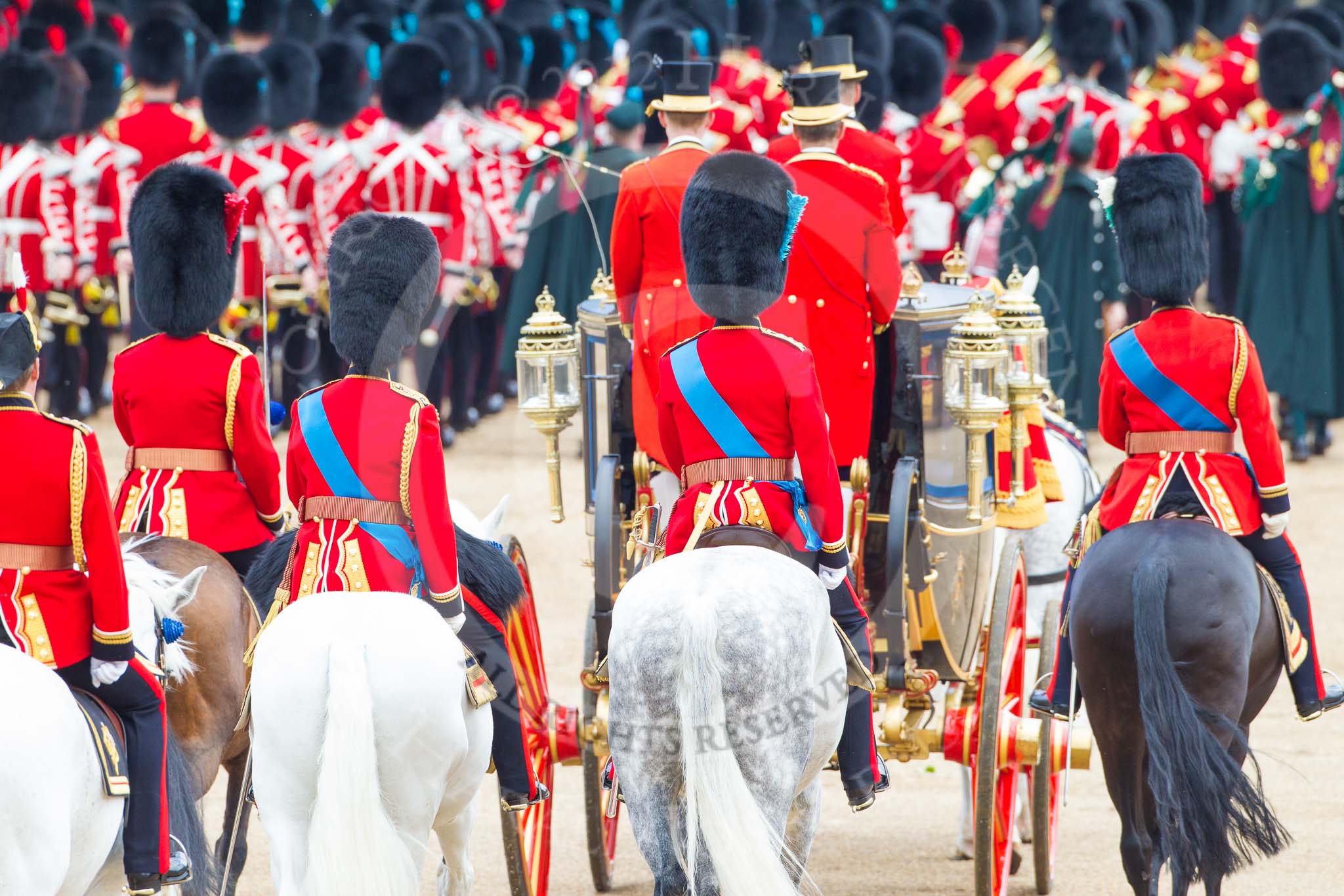 Trooping the Colour 2012: The March Off - the Massed Bands are leaving Horse Guards Parade towards The Mall, followed by HM The Queen in the Glass Coach. Behind them the Field Officer (second from the left) and the Royal Colonels - HRH The Dukeof Kent, HRH The The of Cambridge, and on the right HRH The Prince of Wales..
Horse Guards Parade, Westminster,
London SW1,

United Kingdom,
on 16 June 2012 at 12:12, image #677