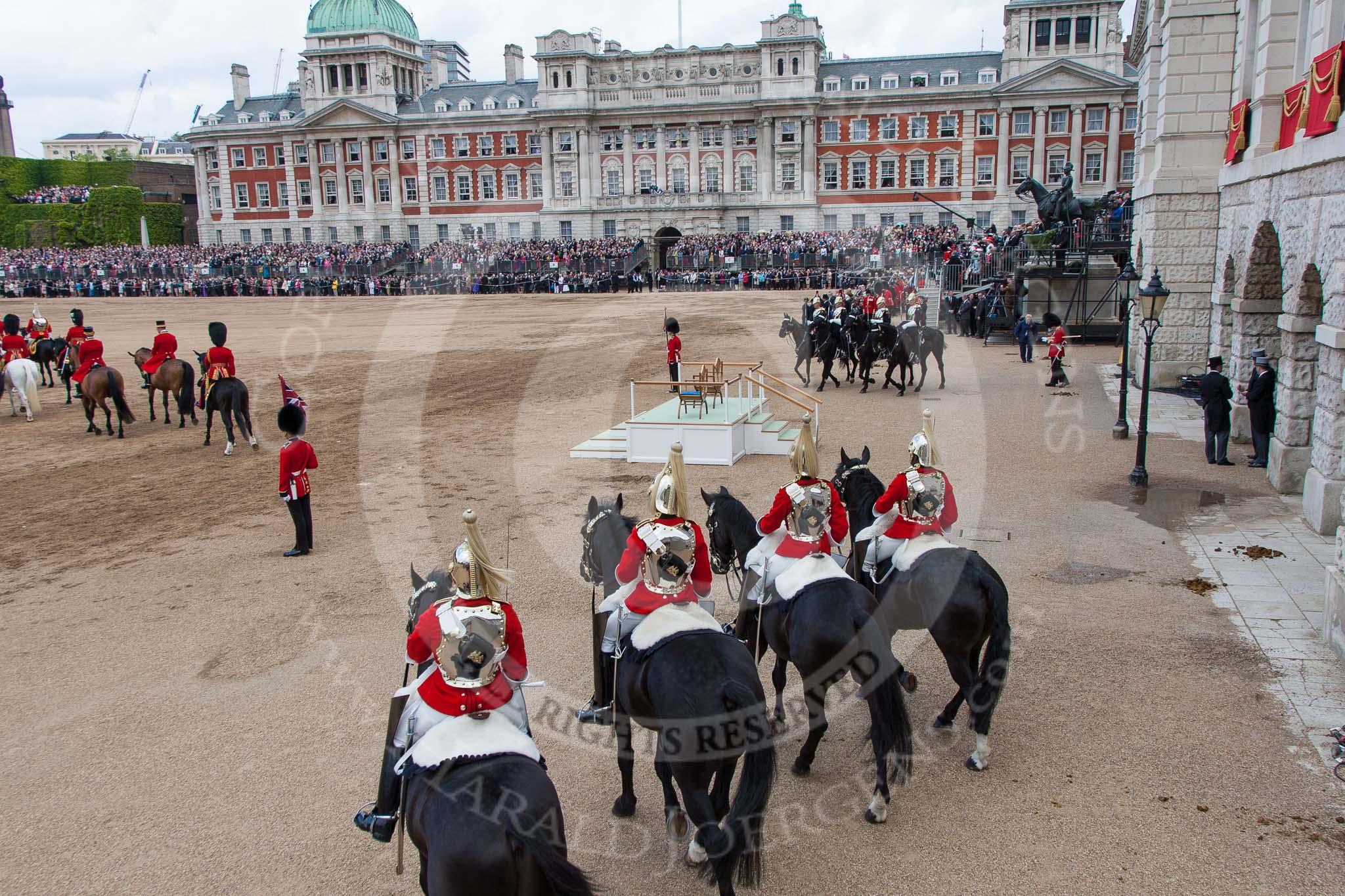 Trooping the Colour 2012: The March Off - members of the Royal Procession on the left of the image, in front the four troopers from The Life Guards, at the right of the saluting base the four troopers from The Blues and Royals..
Horse Guards Parade, Westminster,
London SW1,

United Kingdom,
on 16 June 2012 at 12:13, image #682
