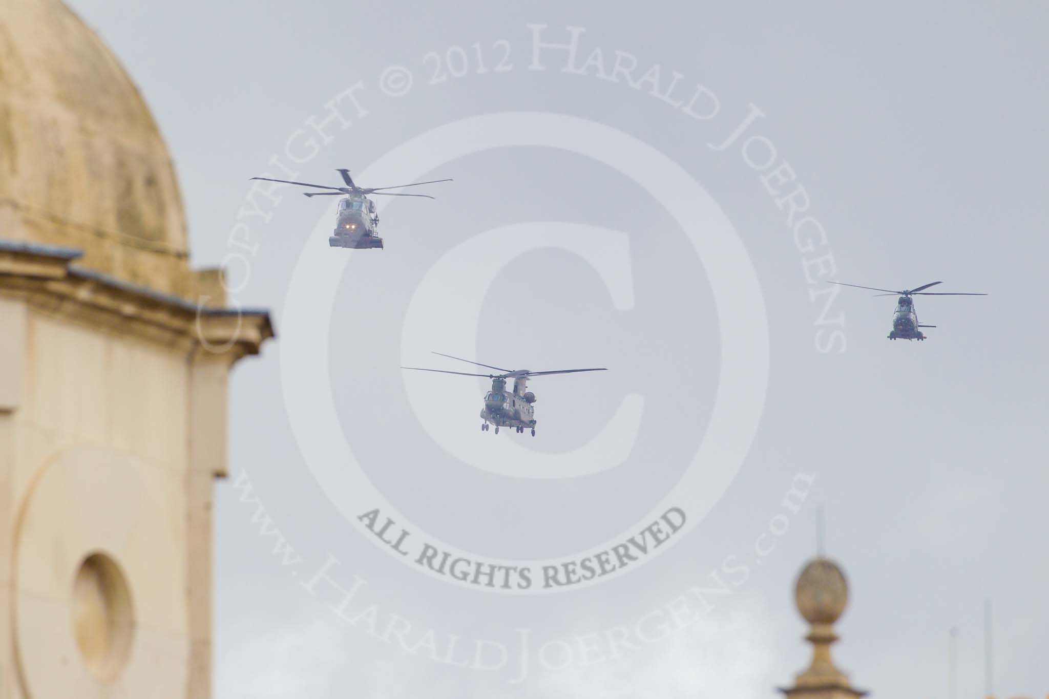 Trooping the Colour 2012: The flypast:  A Merlin-, Chinook-, and Puma helicopter about to fly over Horse Guards Building..
Horse Guards Parade, Westminster,
London SW1,

United Kingdom,
on 16 June 2012 at 12:59, image #713