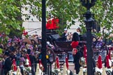 Trooping the Colour 2012: Whilst The Blues and Royals and the Life Guards wait at the access road, the members of the Royal Family that watched the parade from The Major General's Office are driven back, along The Mall, to Buckingham Palace. Here: Prince Harry and the Duchess of Cambridge..
Horse Guards Parade, Westminster,
London SW1,

United Kingdom,
on 16 June 2012 at 12:09, image #650