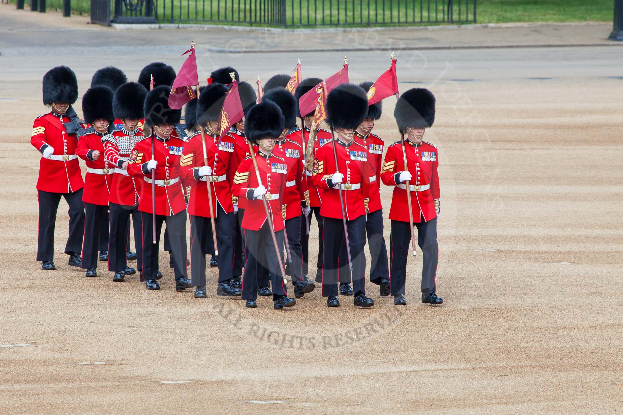 The Colonel's Review 2013: The 'Keepers of the Ground', guardsmen bearing marker flags for their respective regiments, turning towards Horse Guards Parade at the Guards Memorial..
Horse Guards Parade, Westminster,
London SW1,

United Kingdom,
on 08 June 2013 at 09:54, image #28