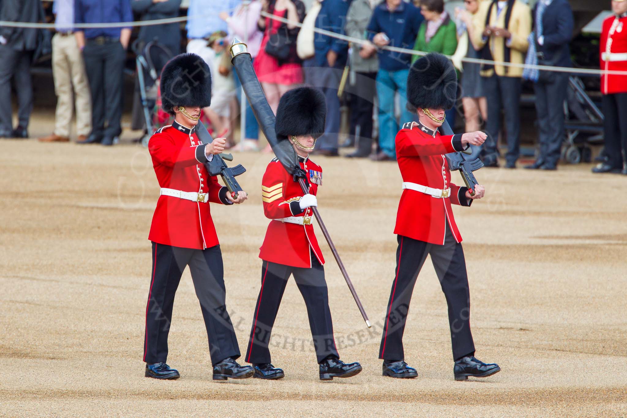 Photo 1306081031221D45259HaraldJoergens The Colonel's Review 2013: Colour Sergeant R J Heath, carrying the Colour and two sentries marching to their position on Horse Guards Parade..
Horse Guards Parade, Westminster,
London SW1,
United Kingdom,
on 08 June 2013 at 10:31, image #128