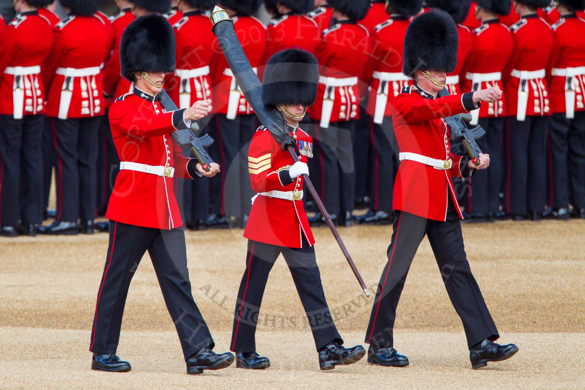 The Colonel's Review 2013: Colour Sergeant R J Heath, carrying the Colour and two sentries marching to their position on Horse Guards Parade..
Horse Guards Parade, Westminster,
London SW1,

United Kingdom,
on 08 June 2013 at 10:31, image #130