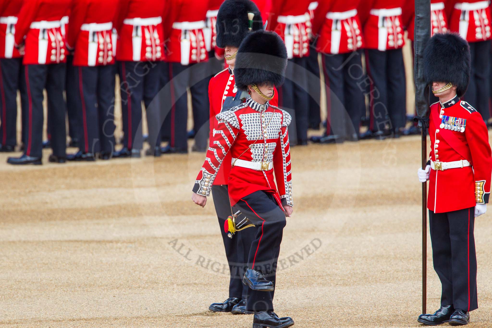 The Colonel's Review 2013: Welsh Guards Drummer approaching Colour Sergeant R J Heath, Welsh Guards, carrying the Colour and the two sentries..
Horse Guards Parade, Westminster,
London SW1,

United Kingdom,
on 08 June 2013 at 10:32, image #141