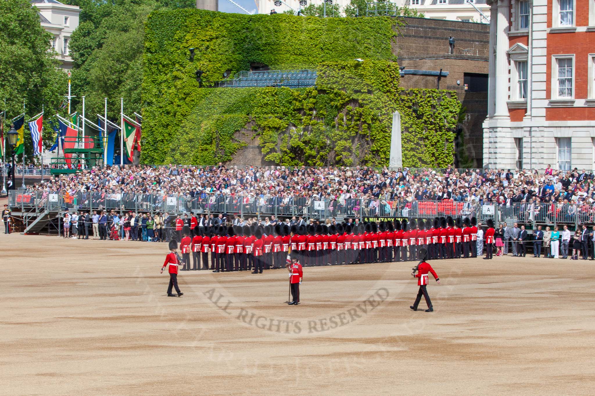 The Colonel's Review 2013: The Colour is now uncased, and the two sentries patrol to the left and right, to protect the Colour..
Horse Guards Parade, Westminster,
London SW1,

United Kingdom,
on 08 June 2013 at 10:34, image #159