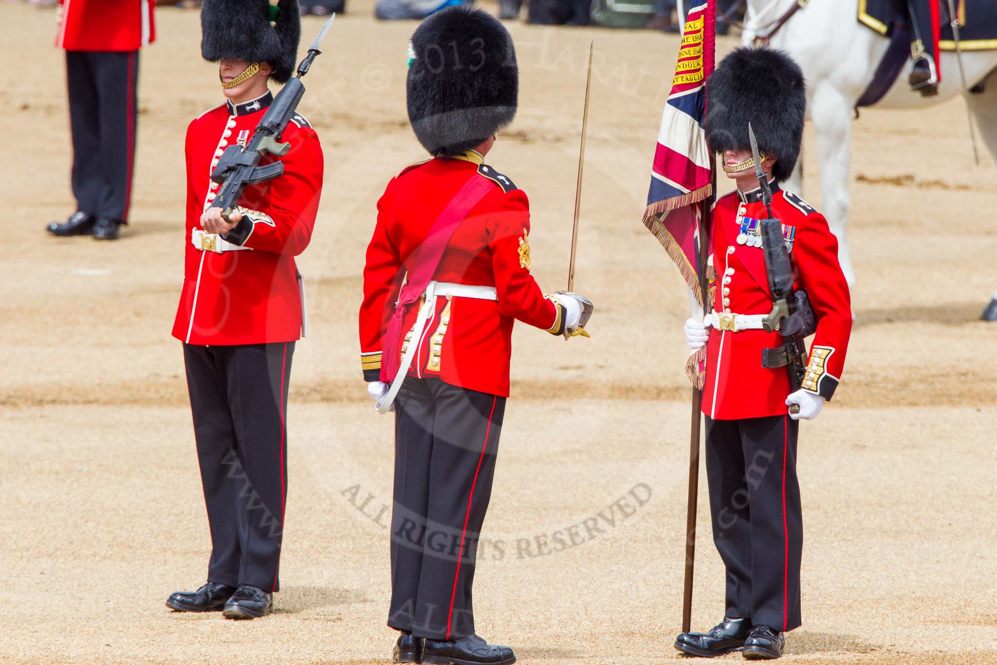 The Colonel's Review 2013: No. 1 Guard the Regimental Sergeant Major, WO1 Martin Topps, Welsh Guards saluting the Colour with his sword..
Horse Guards Parade, Westminster,
London SW1,

United Kingdom,
on 08 June 2013 at 11:19, image #500