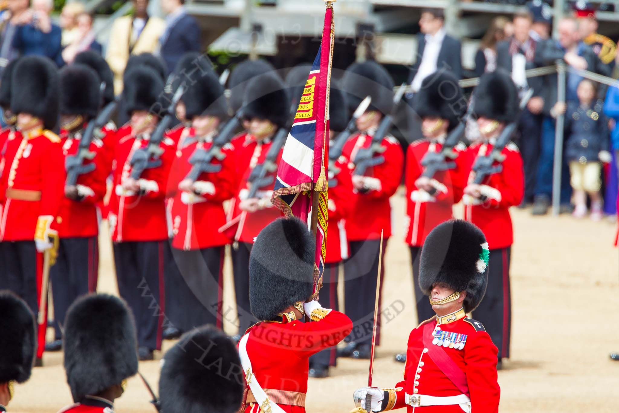 The Colonel's Review 2013: The Ensign, Second Lieutenant Joel Dinwiddle, takes posession of the Colour from the Regimental Sergeant Major, WO1 Martin Topps, Welsh Guards..
Horse Guards Parade, Westminster,
London SW1,

United Kingdom,
on 08 June 2013 at 11:20, image #525