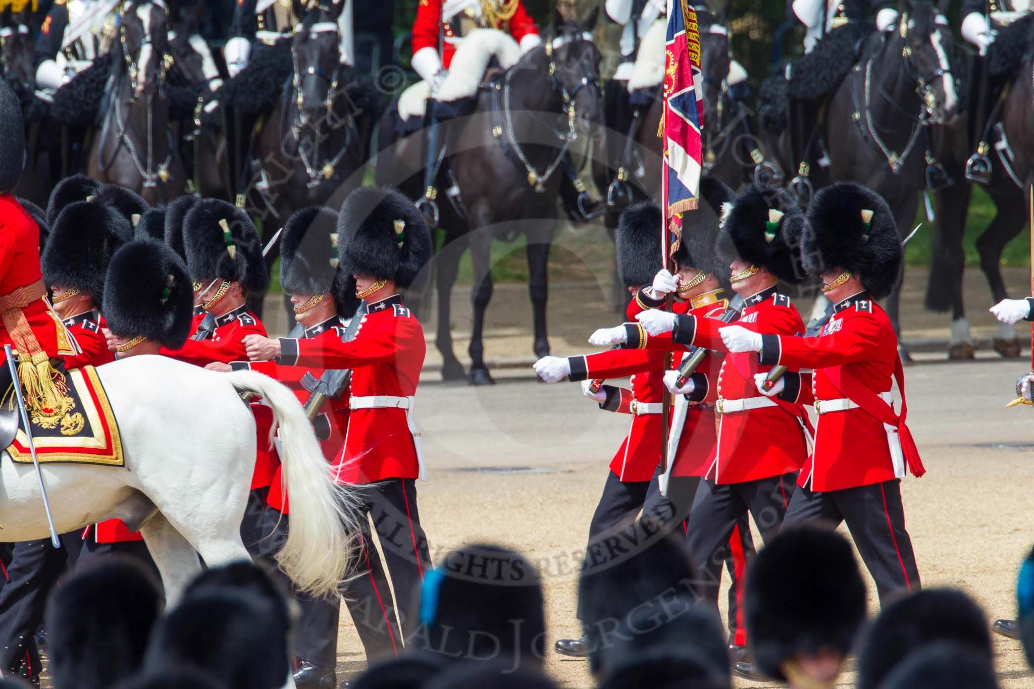 The Colonel's Review 2013: No. 1 Guard (Escort for the Colour),1st Battalion Welsh Guards, at the beginning of the March Past in Quick Time. Behind them The Blues and Royals of the Household Cavalry. The Field Officer returns to the head of the march past..
Horse Guards Parade, Westminster,
London SW1,

United Kingdom,
on 08 June 2013 at 11:40, image #676
