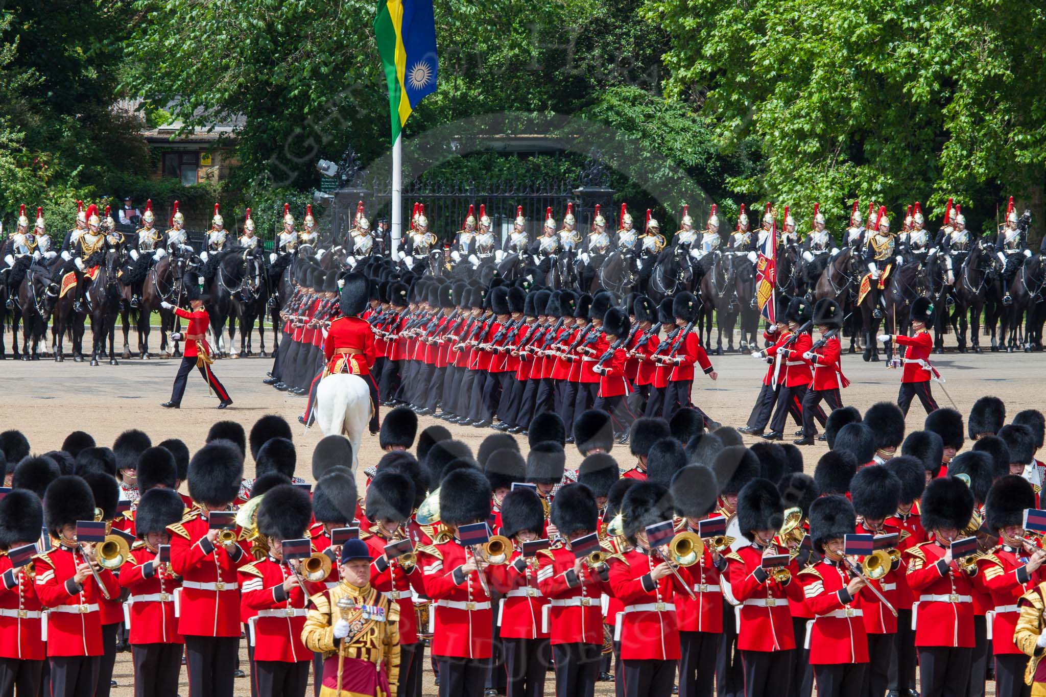 The Colonel's Review 2013: The March Past in Quick Time. The guards are marching beween the Massed Bands, in front, and the Blues and Royals behind them..
Horse Guards Parade, Westminster,
London SW1,

United Kingdom,
on 08 June 2013 at 11:47, image #706