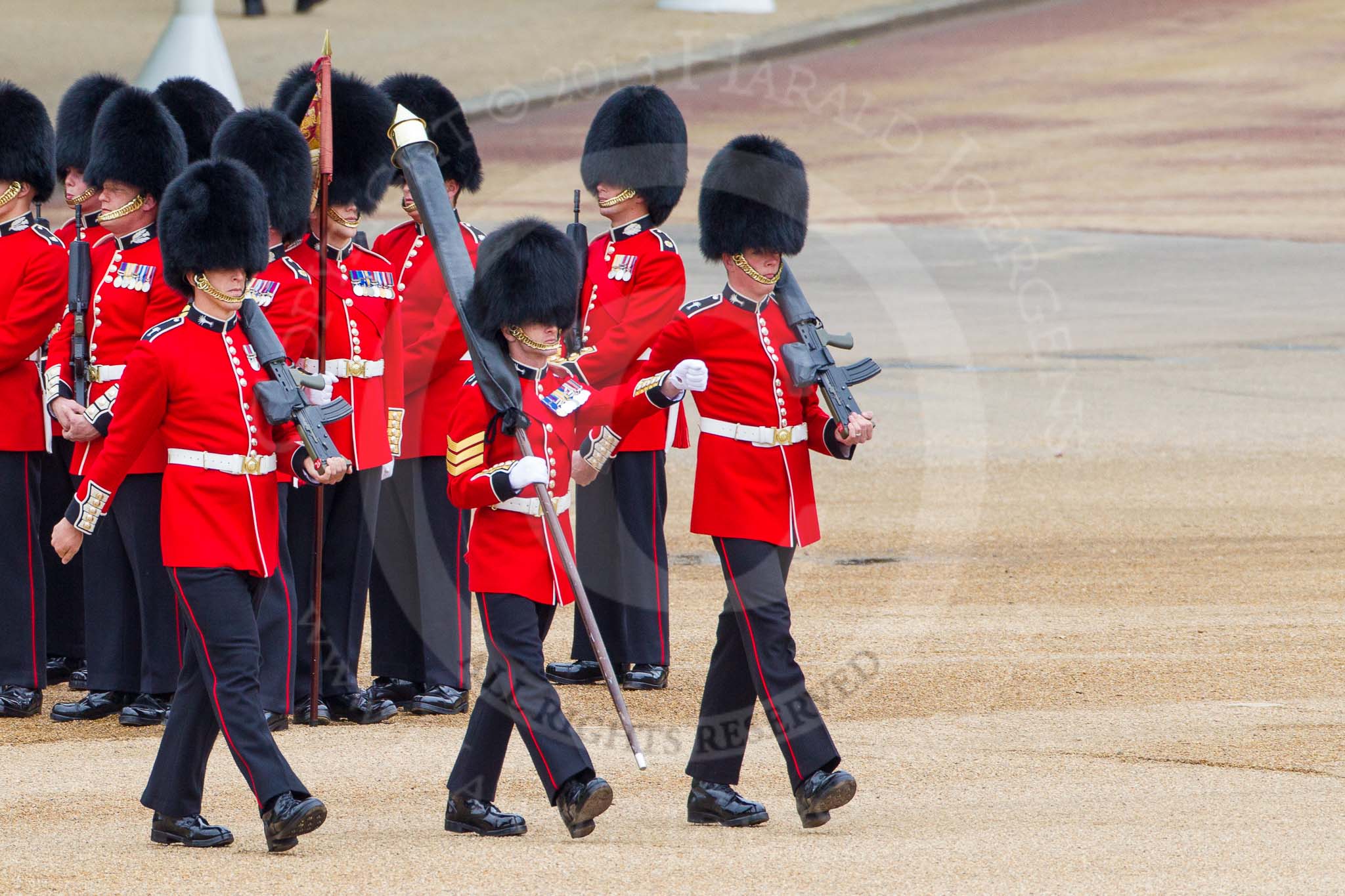 Major General's Review 2013: Colour Sergeant Robert J Heath, carrying the Colour and two sentries, Guardsman Bilton and Guardsman Pervis, marching to their position on Horse Guards Parade..
Horse Guards Parade, Westminster,
London SW1,

United Kingdom,
on 01 June 2013 at 10:30, image #113