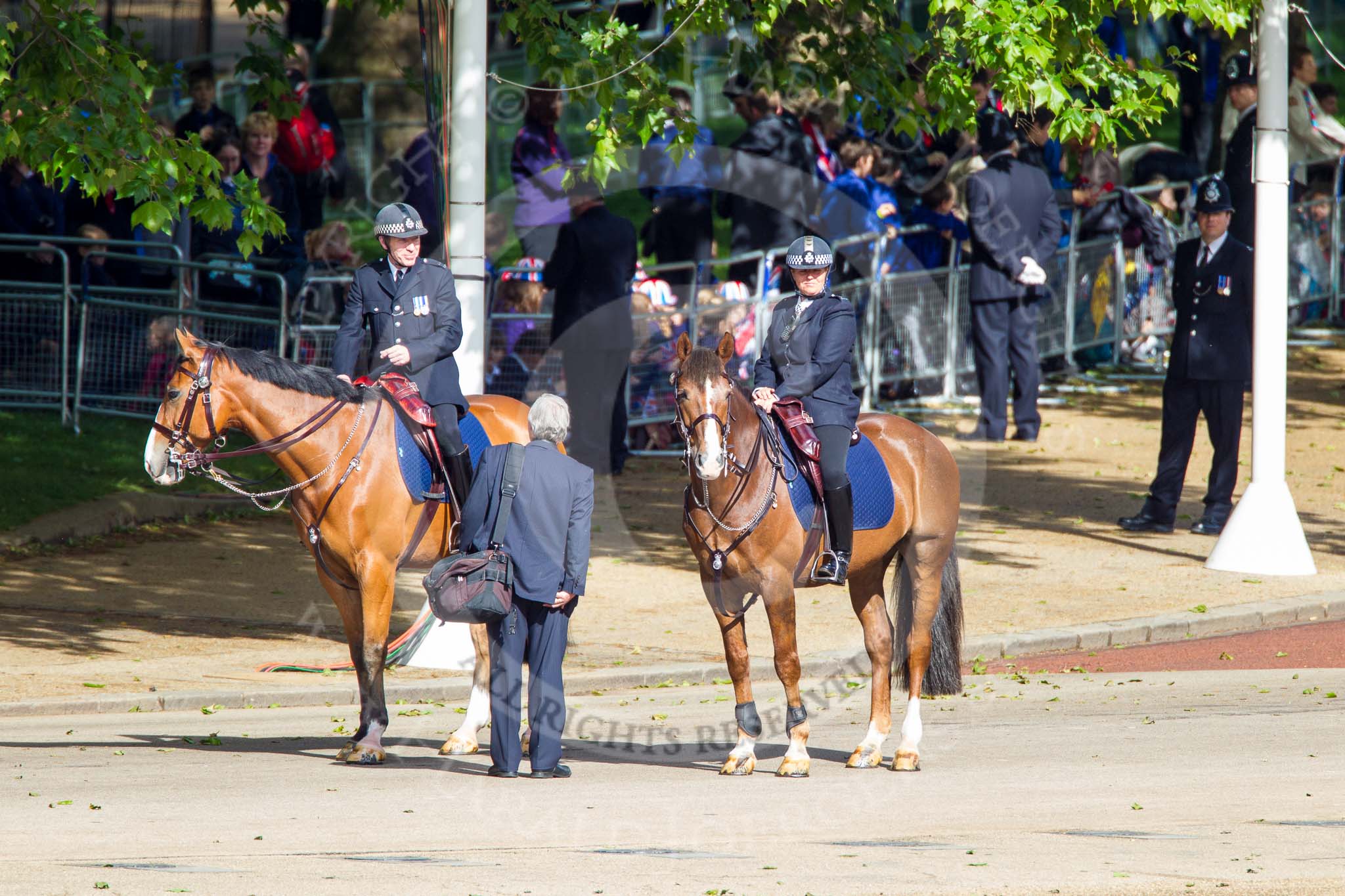 Trooping the Colour 2013: Mounted Metropolitan Police at Horse Guards Road, with the Youth Camp on the corner of The Mall/Horse Guards Road behind them. Image #6, 15 June 2013 08:45 Horse Guards Parade, London, UK