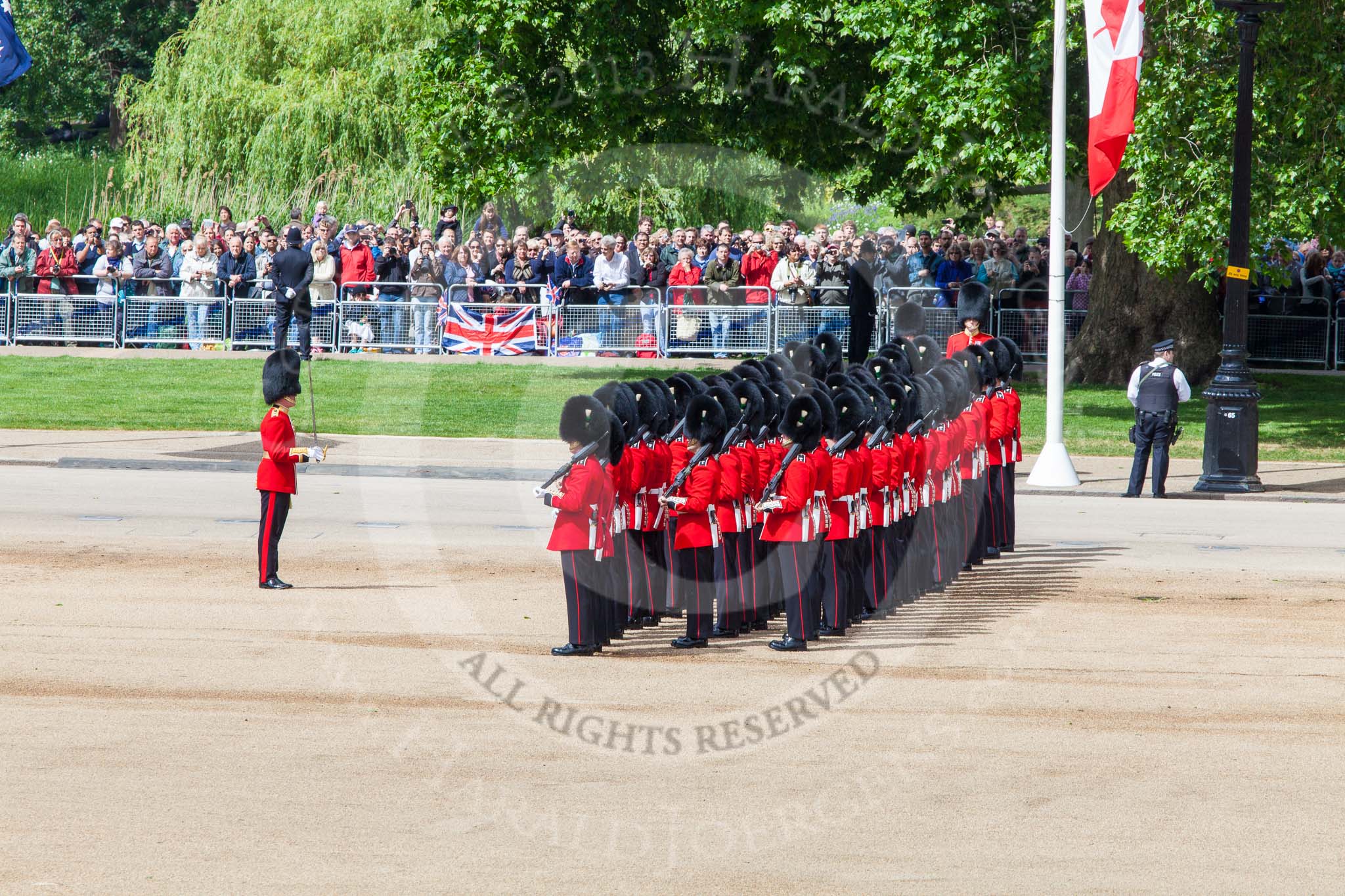 Trooping the Colour 2013: No. 1 Guard (Escort for the Colour),1st Battalion Welsh Guards. Behind them spectators watching from St James's Park. Image #116, 15 June 2013 10:32 Horse Guards Parade, London, UK