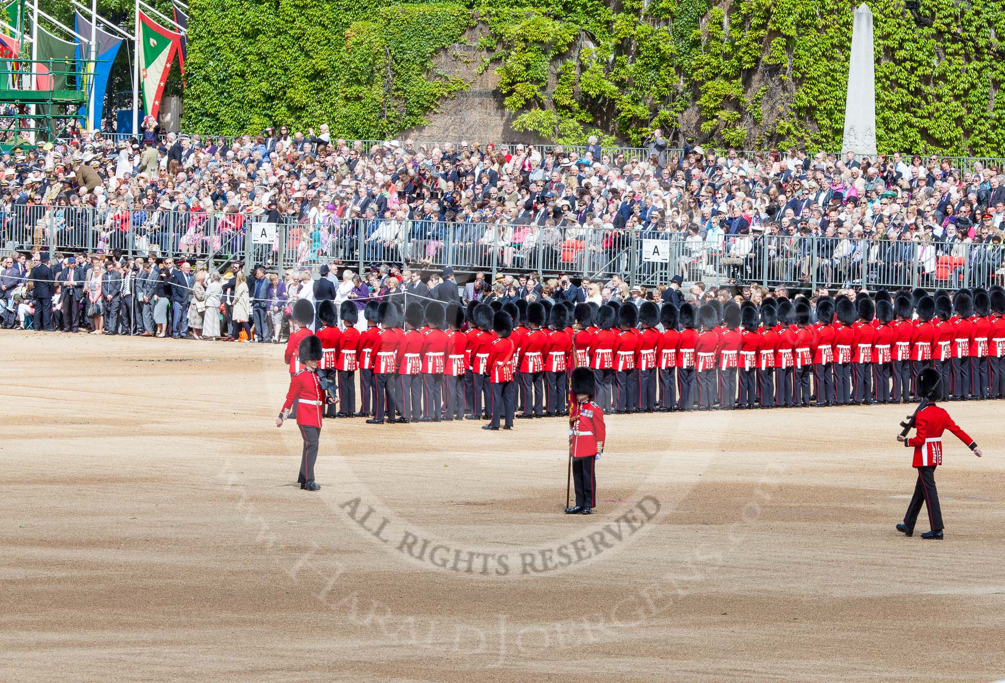 Trooping the Colour 2013: The Colour is now uncased, and the two sentries patrol to the left and right, to protect the Colour. Image #124, 15 June 2013 10:34 Horse Guards Parade, London, UK