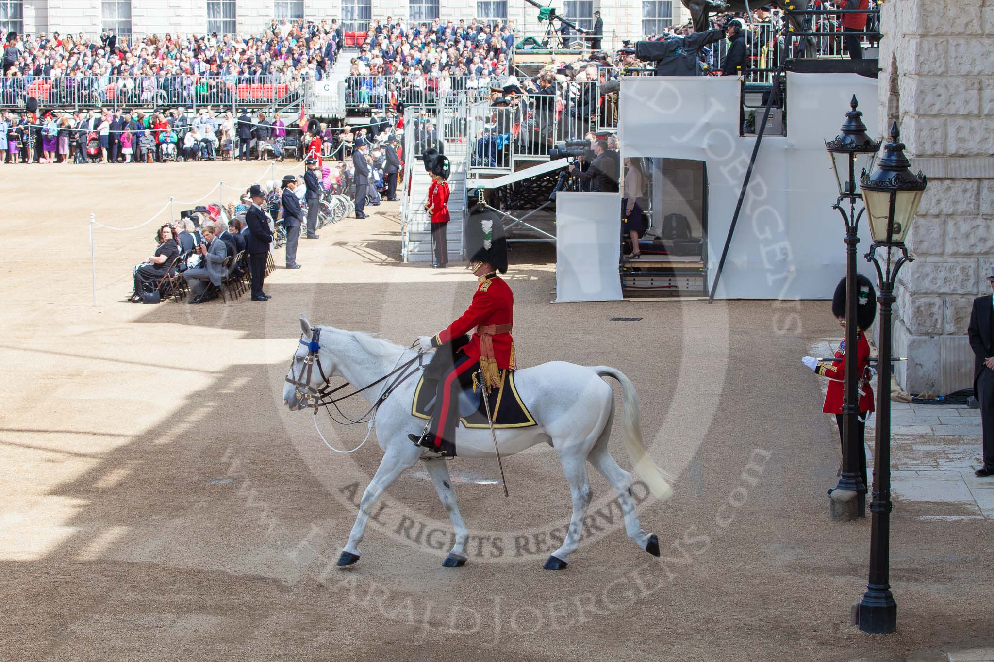 Trooping the Colour 2013: The Adjutant of the Parade, Captain C J P Davies, Welsh Guards, leaving Horse Guards Arch to ride onto Horse Guards Parade. Image #126, 15 June 2013 10:34 Horse Guards Parade, London, UK