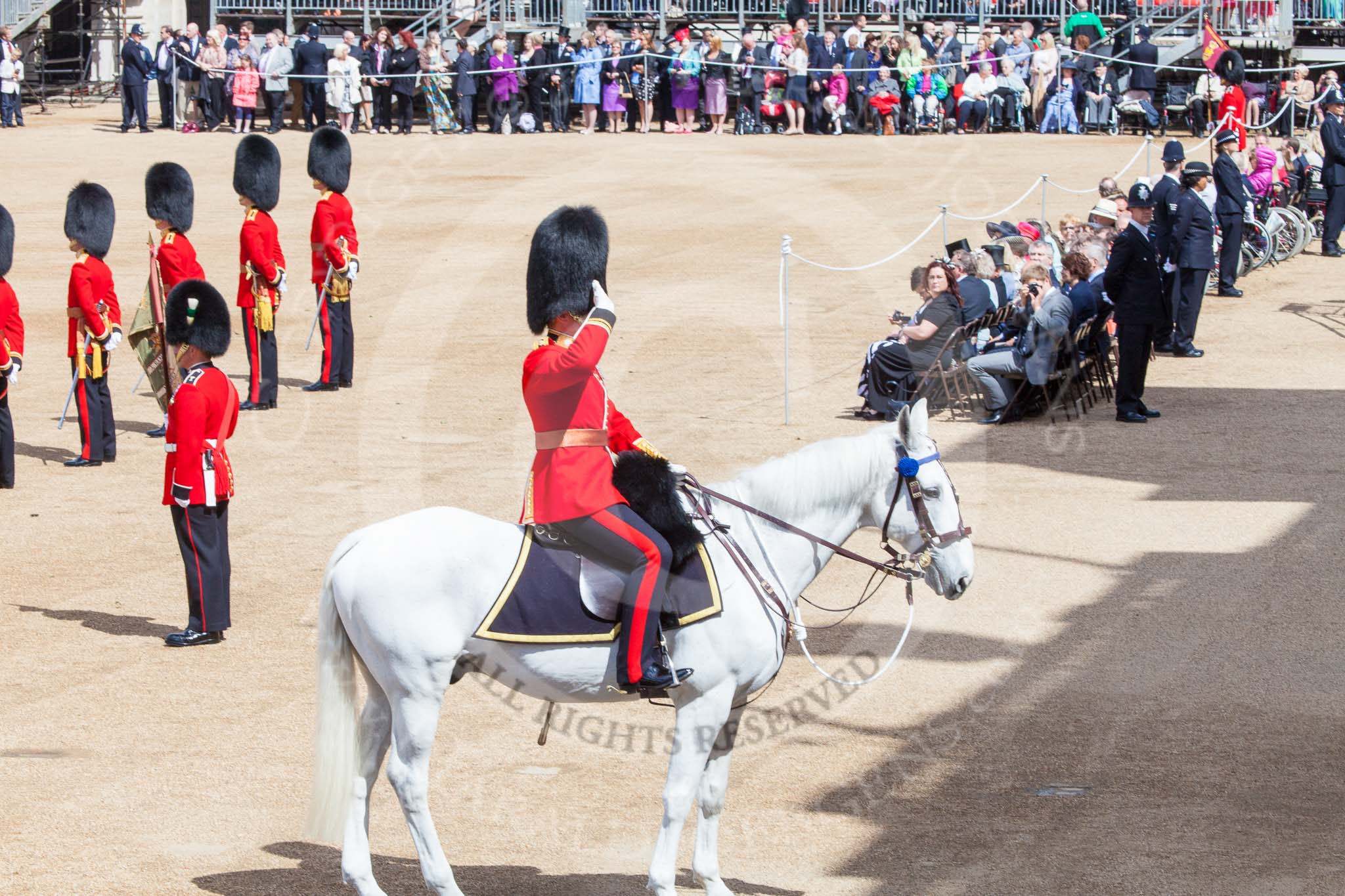 Trooping the Colour 2013: The Adjutant of the Parade, Captain C J P Davies, Welsh Guards, salutes to the Field Officer before proceeding to the eastern end of the line of 18 officers. Image #154, 15 June 2013 10:40 Horse Guards Parade, London, UK