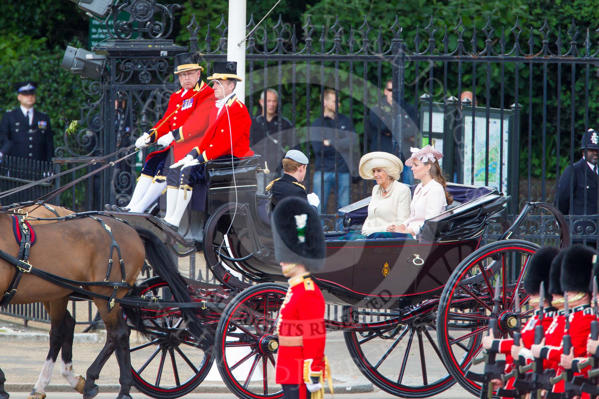 Trooping the Colour 2013: HRH Prince Harry of Wales, HRH The Duchess of Cornwall  and HRH The Duchess of Cambridge in the first barouche carriage on the way across Horse Guards Parade to watch the parade from the Major General's office. Image #189, 15 June 2013 10:49 Horse Guards Parade, London, UK