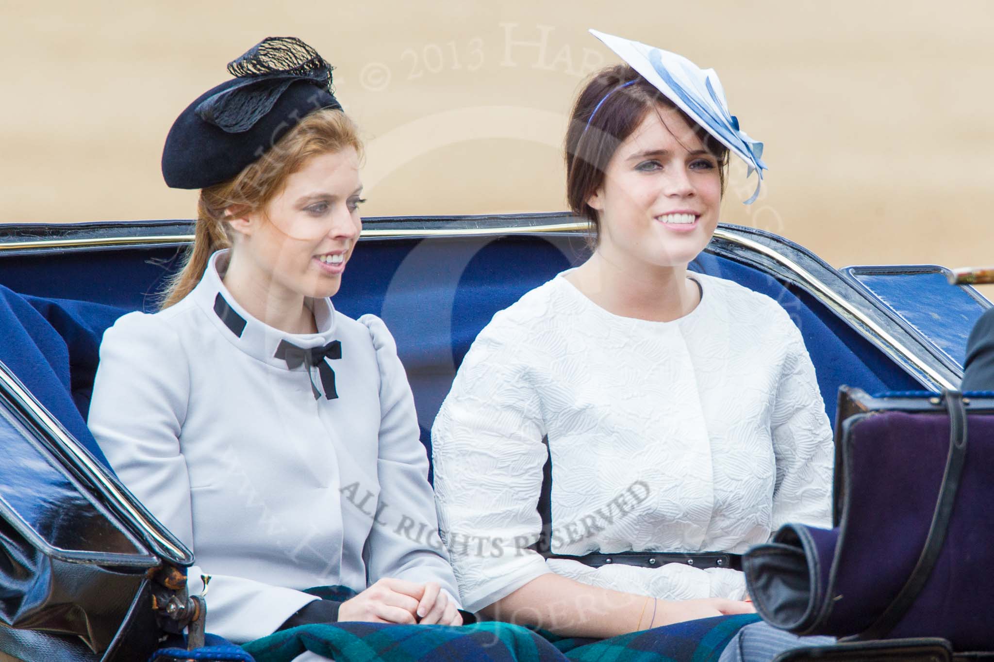 Trooping the Colour 2013: HRH Princess Beatrice of York and HRH Princess Eugenie of York in the second barouche carriage on the way across Horse Guards Parade to watch the parade from the Major General's office..
Horse Guards Parade, Westminster,
London SW1,

United Kingdom,
on 15 June 2013 at 10:50, image #210