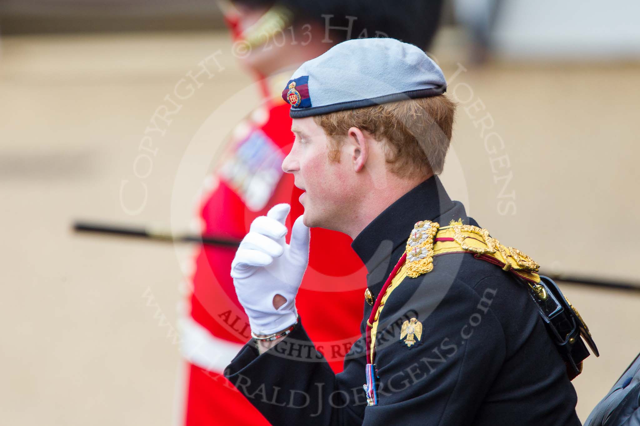 Trooping the Colour 2013: HRH Prince Harry of Wales in the first barouche carriage on the way across Horse Guards Parade to watch the parade from the Major General's office. Behind him WO1 GSM Mott with his pace stick..
Horse Guards Parade, Westminster,
London SW1,

United Kingdom,
on 15 June 2013 at 10:50, image #212